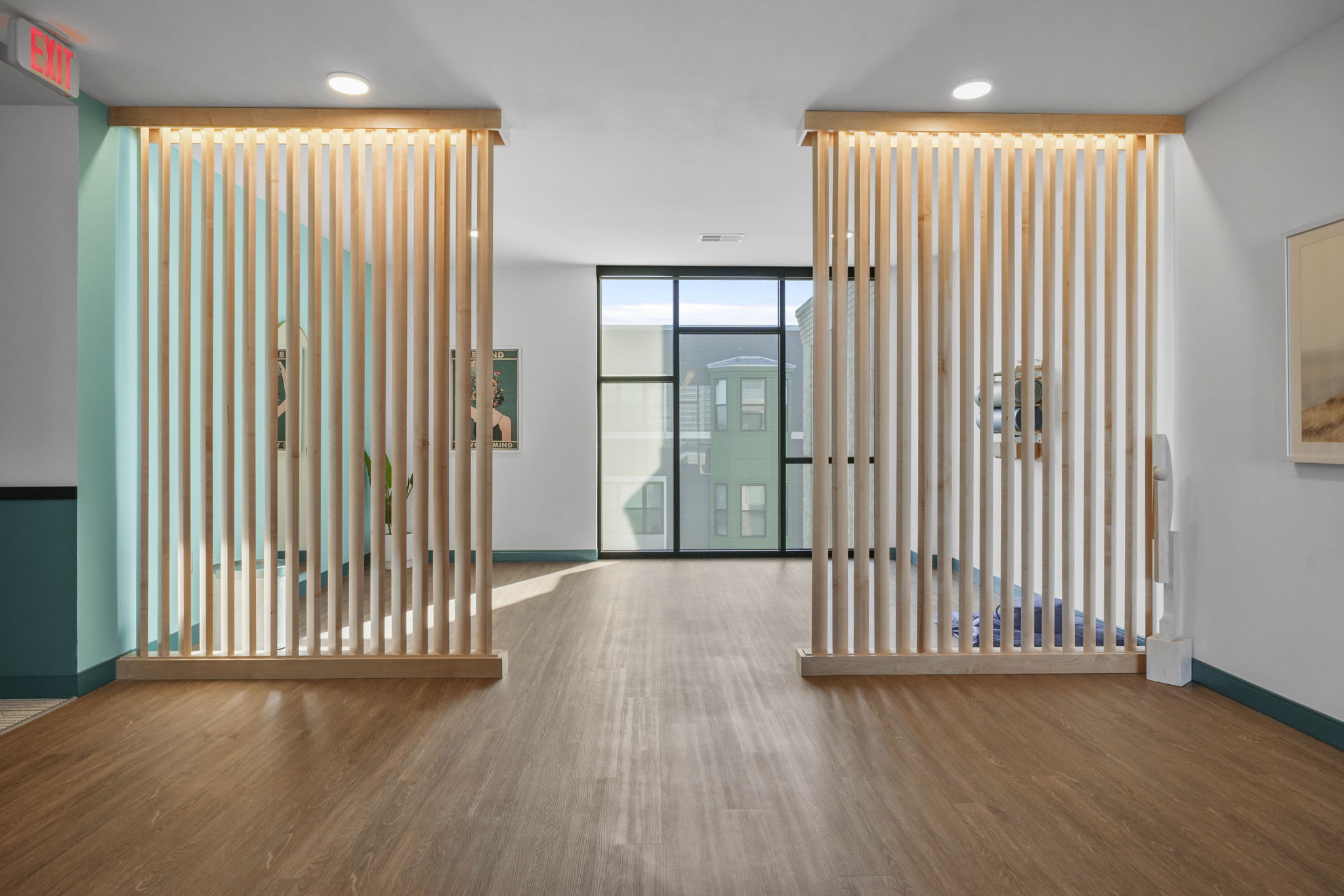 A flexible studio space designed for yoga, stretching, and other wellness focused activities.