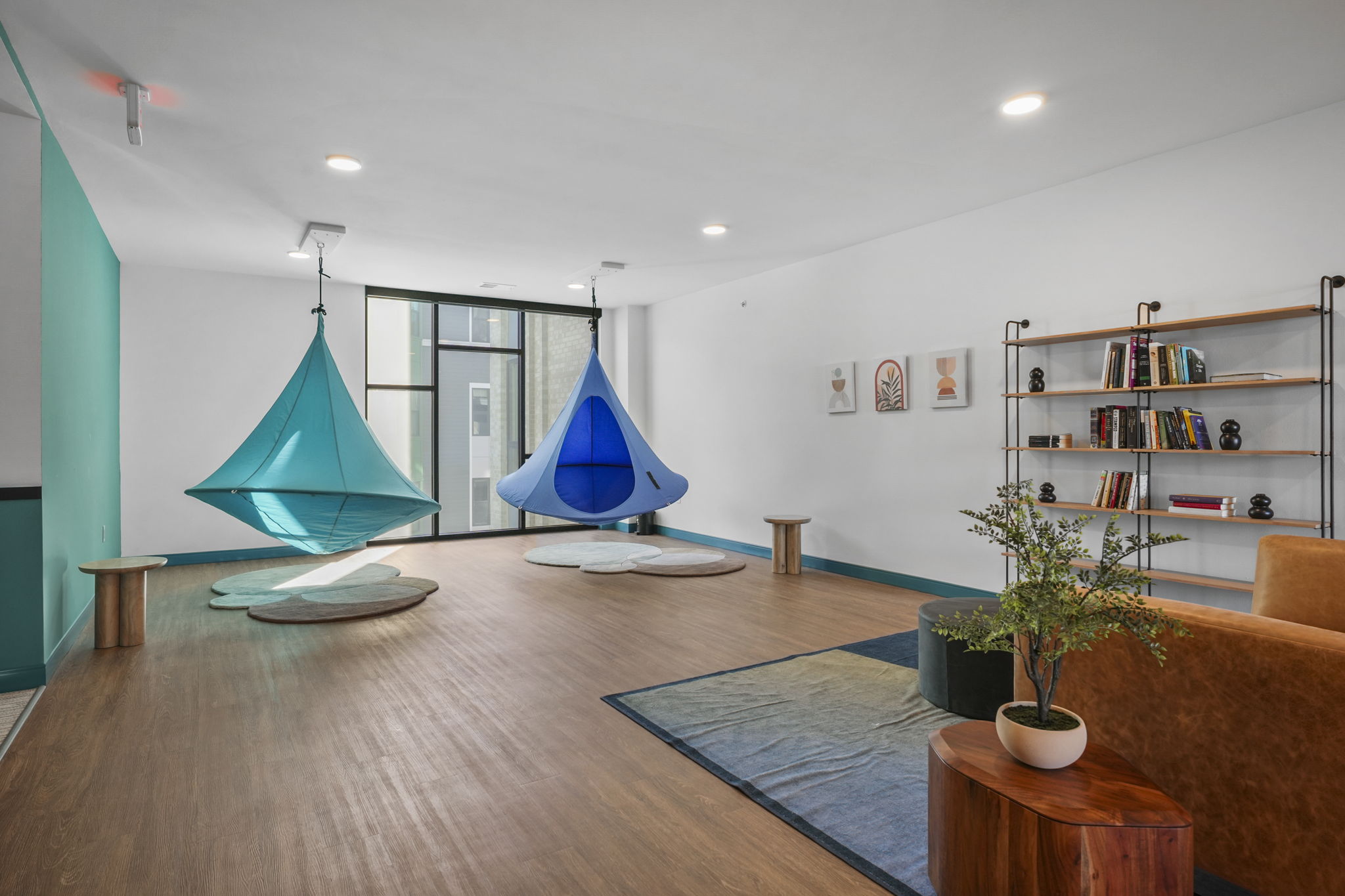 The Irwin den with lounge seating, game table, and relaxed space for residents to gather