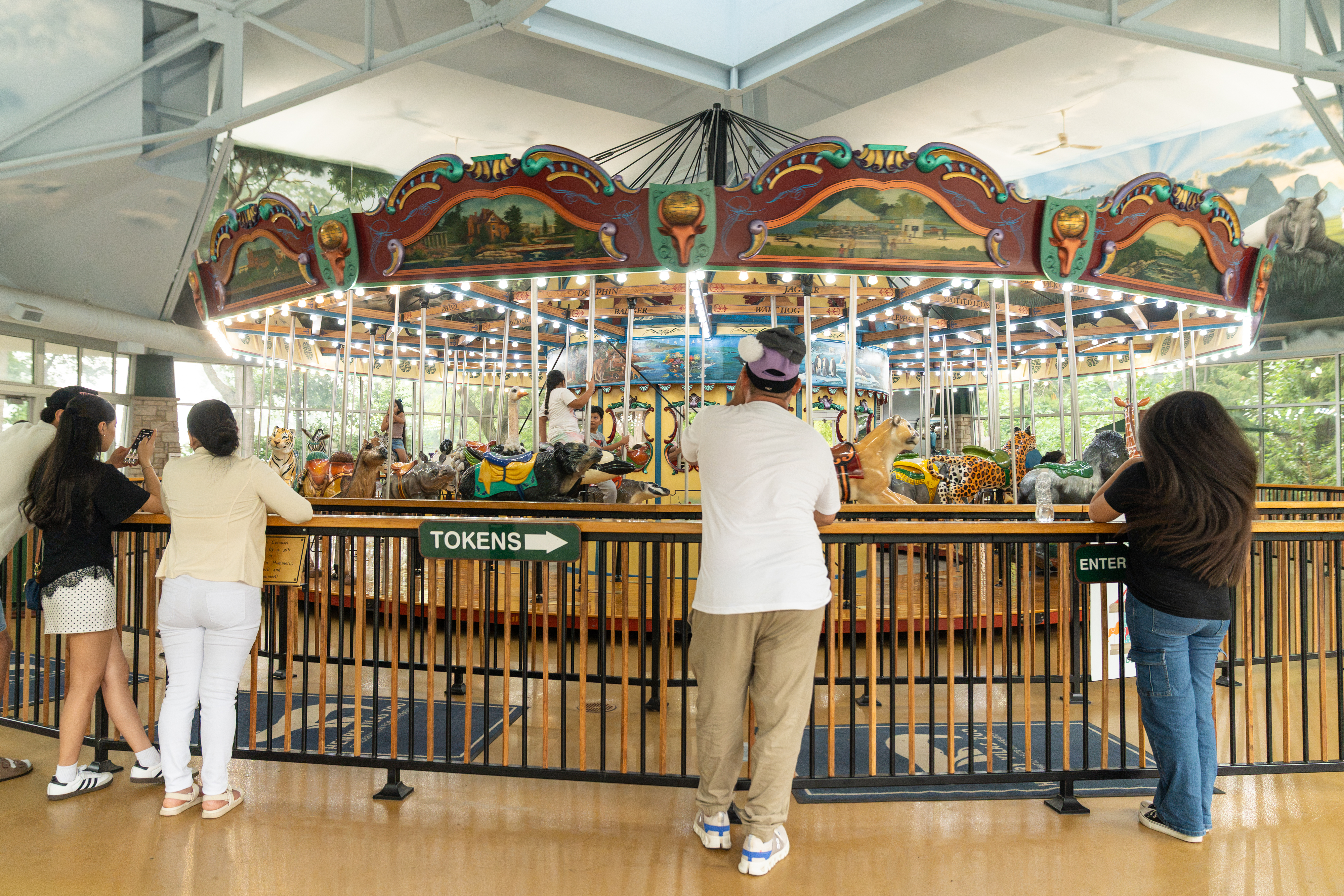 Urban Land Interests employees and their families enjoying the carousel during the annual company picnic at Henry Vilas Zoo in Madison