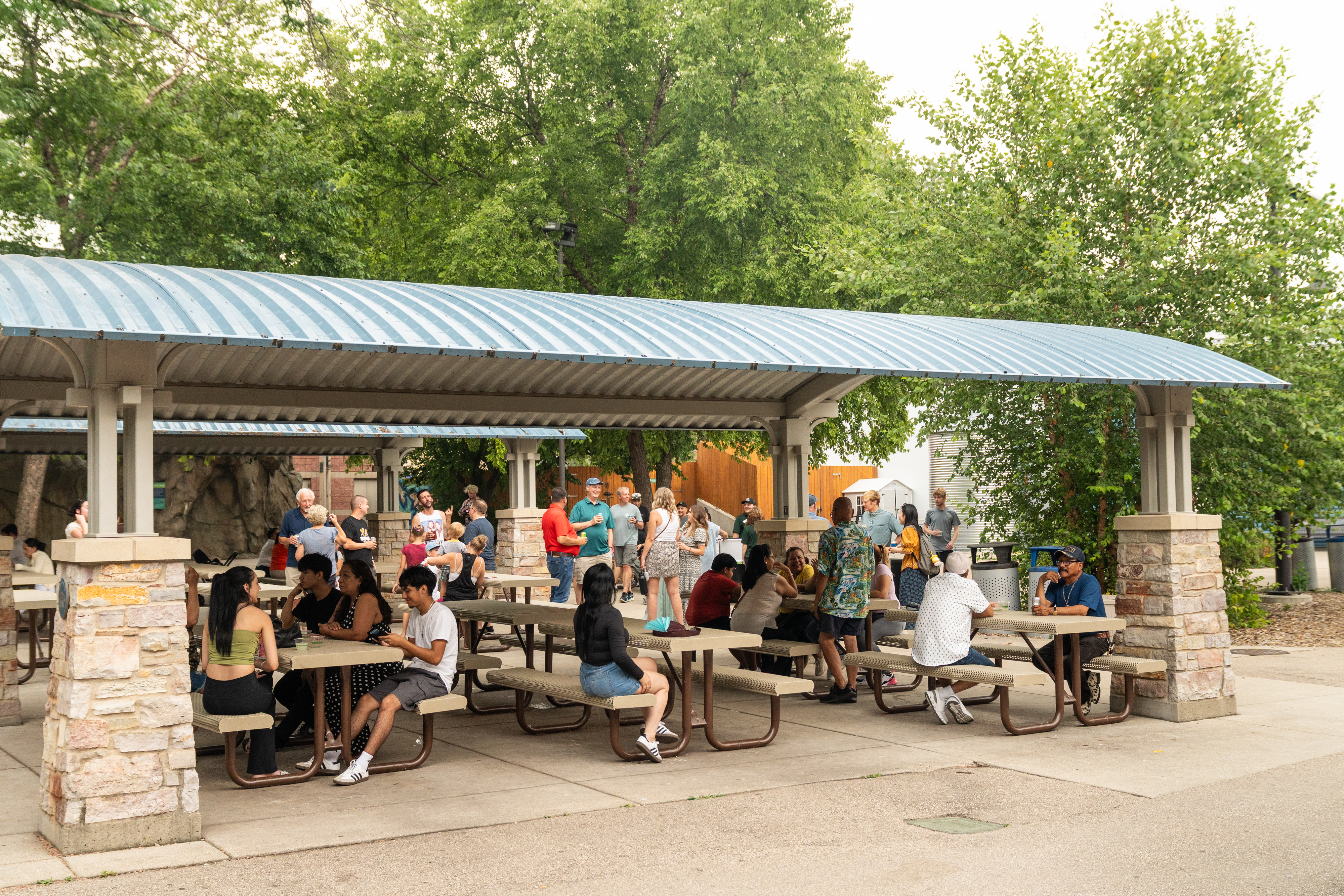 ULI employees and guests enjoying food, refreshments, and conversation during the annual company picnic at Henry Vilas Zoo