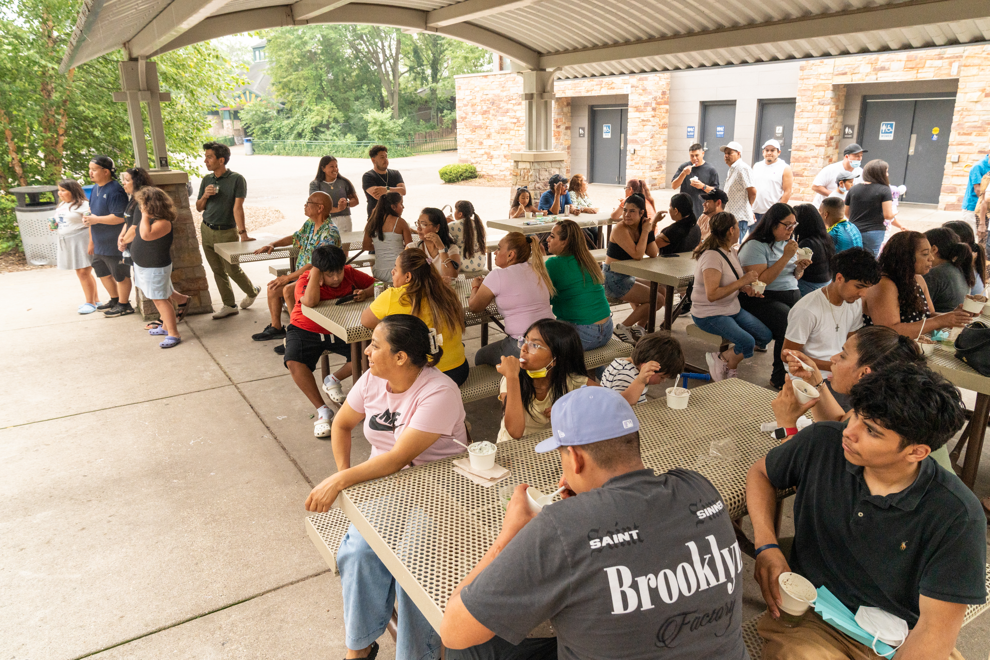 Urban Land Interests employees and their families enjoying ice cream and refreshments during the annual company picnic at Henry Vilas Zoo