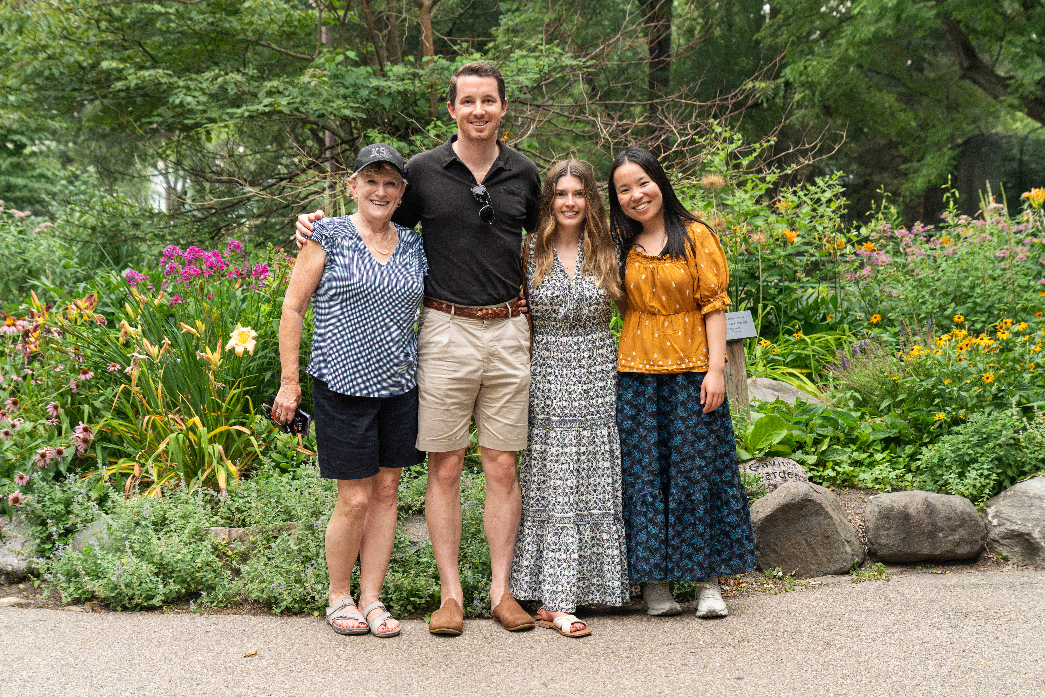 Urban Land Interests employees and their family members posing together in the gardens at Henry Vilas Zoo during the annual company picnic
