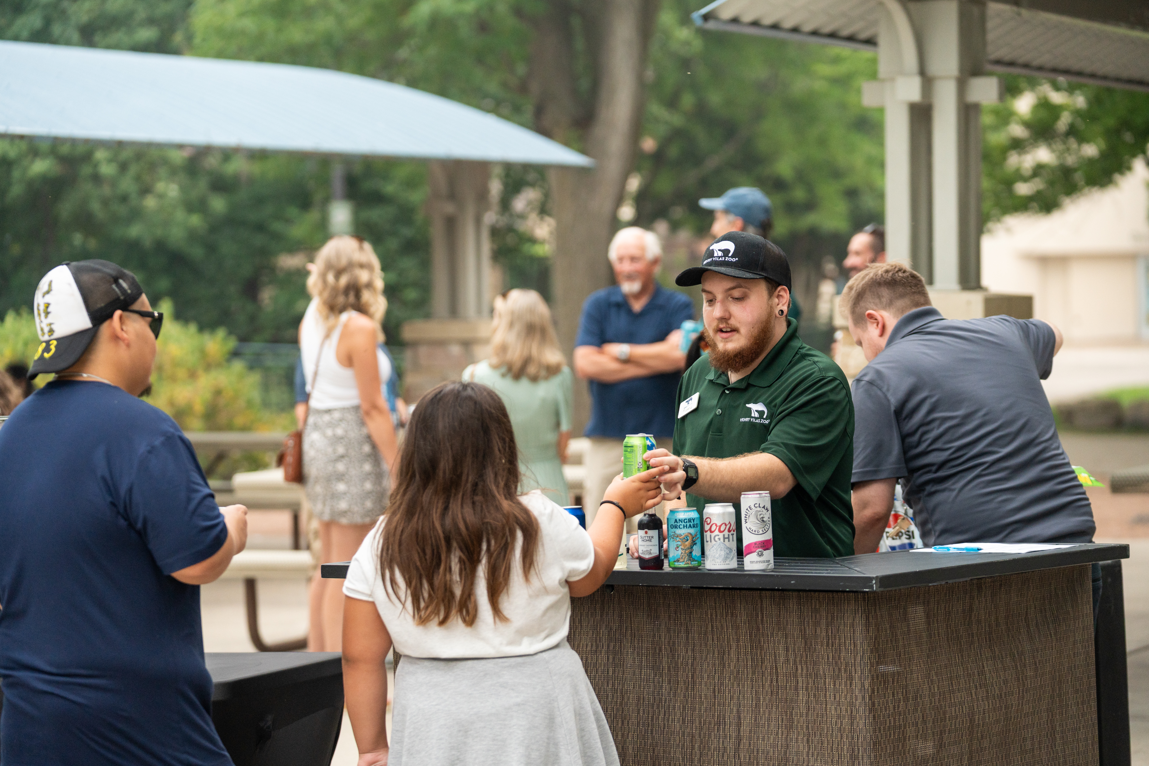 Guests receiving refreshments during the Urban Land Interests annual company picnic at Henry Vilas Zoo