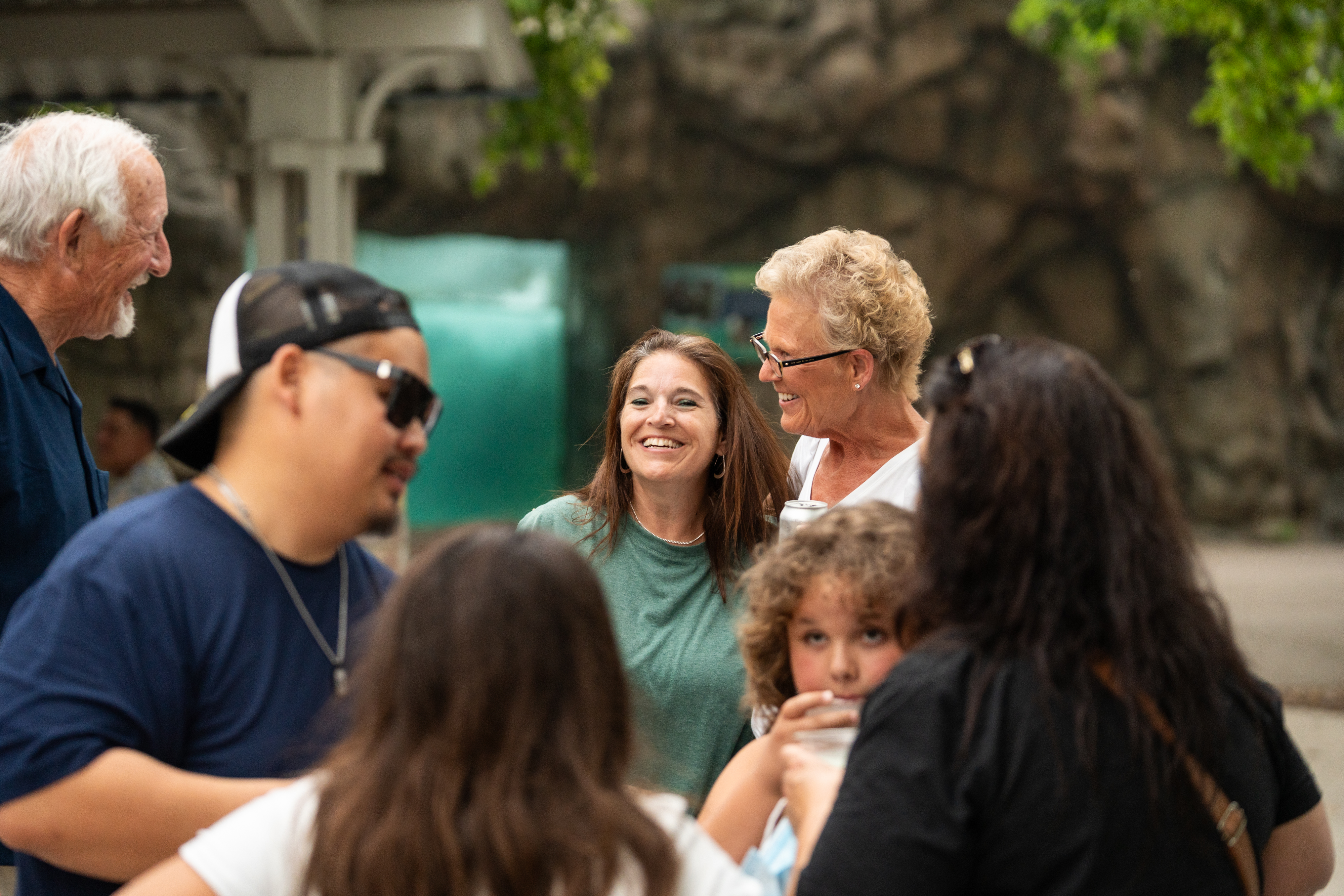 Urban Land Interests employees and their families sharing conversation and refreshments during the annual company picnic at Henry Vilas Zoo