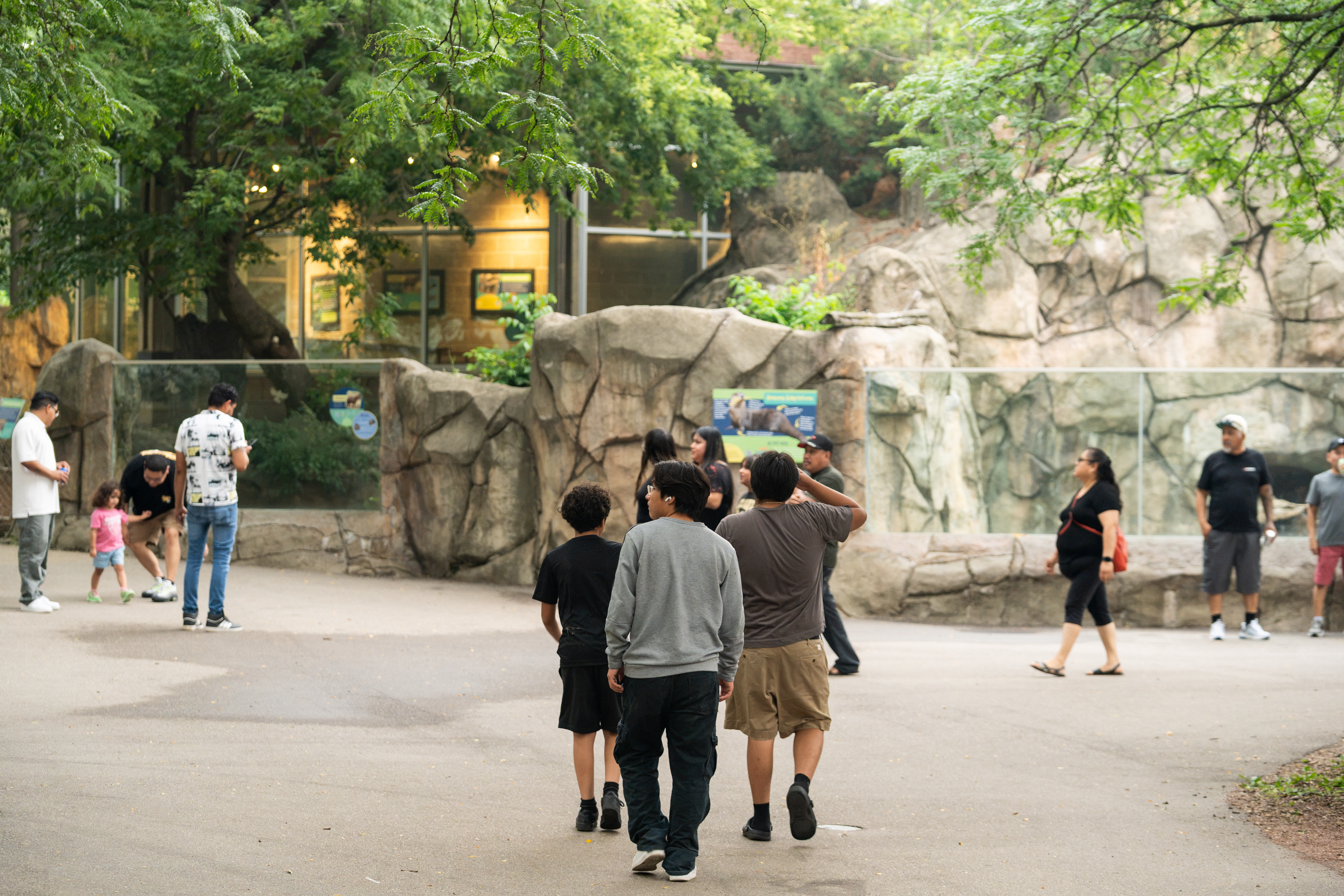 ULI employees and their families walking through animal exhibits during the annual company picnic at Henry Vilas Zoo in Madison