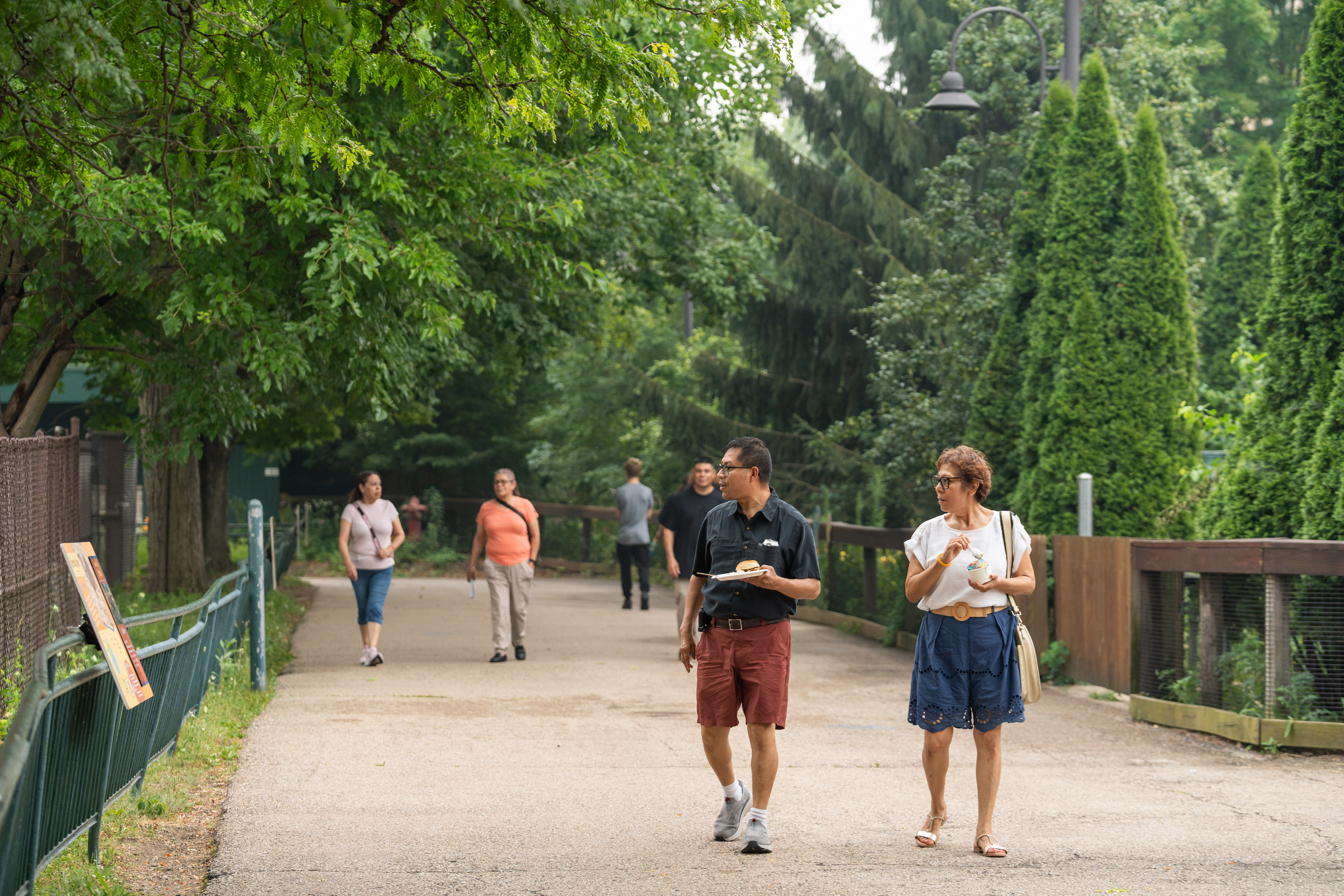 Guests stroll through Henry Vilas Zoo while enjoying food and ice cream during the Urban Land Interests annual company picnic.