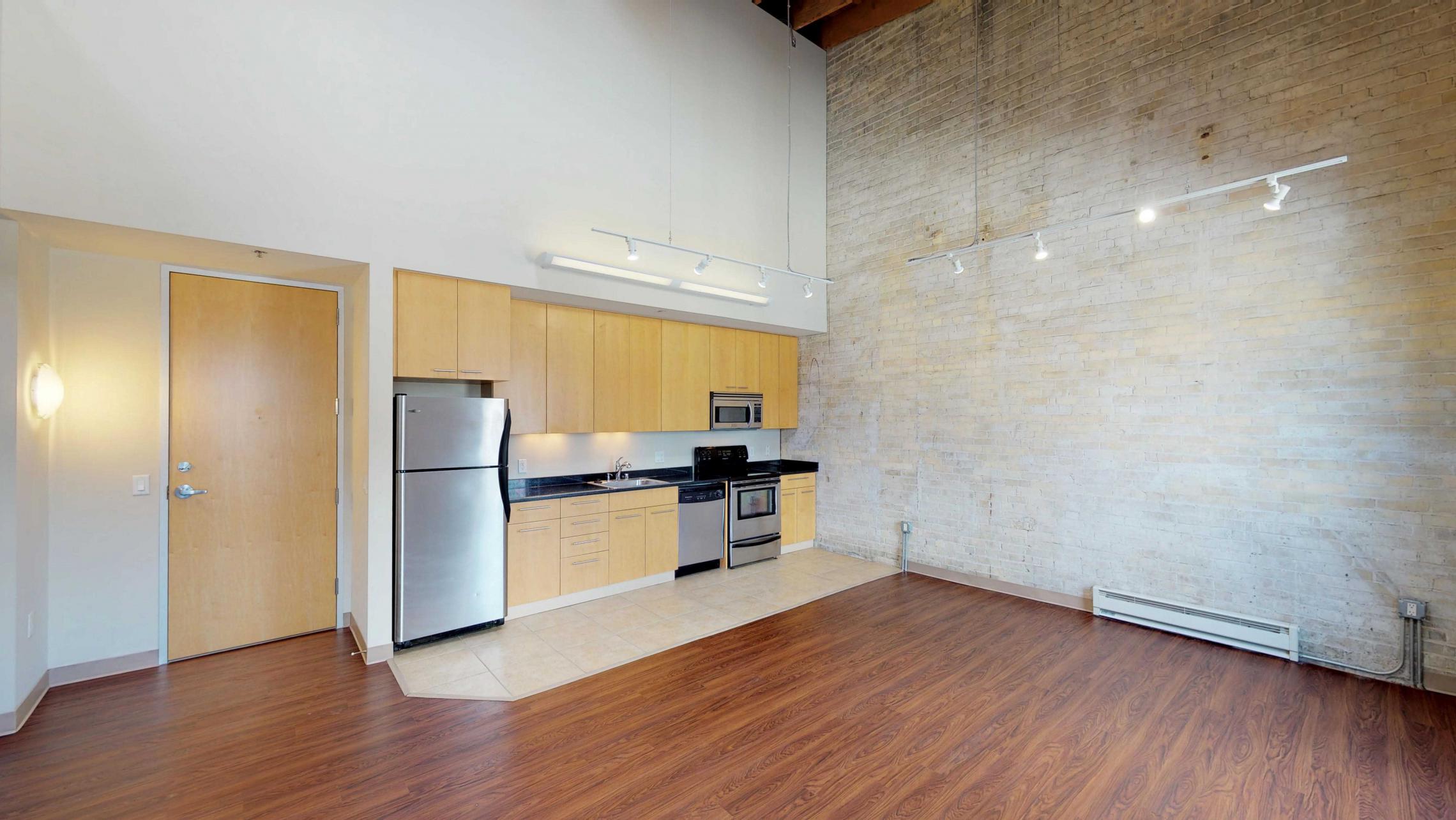 Tobacco-Lofts-Apartment-E307-Historic-Downtown-Lofted-Two-Bedroom-Madison-Exposed-Brick-Design-Beams-Dining