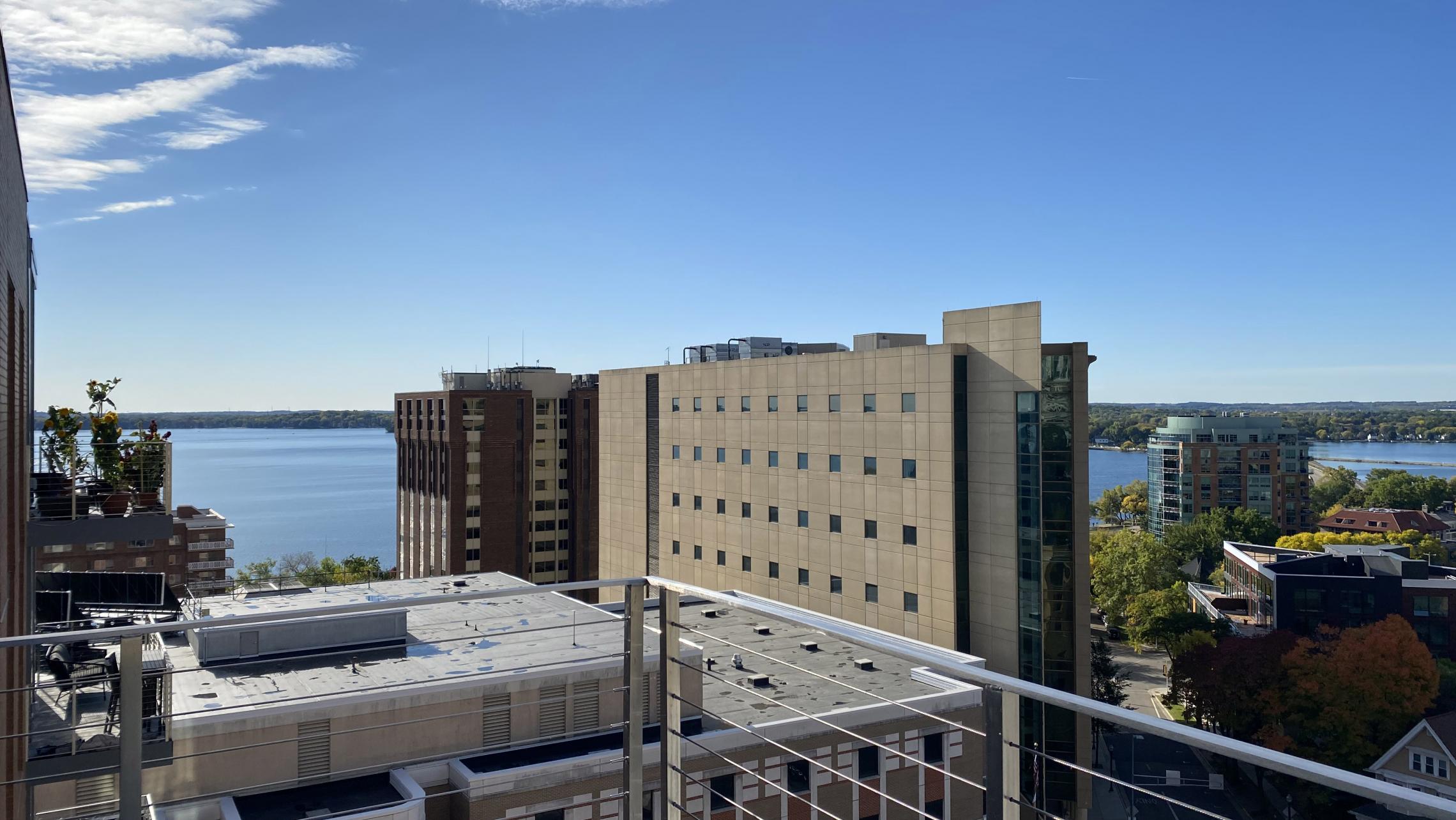 The-Pressman-Apartments-Two-Bedroom-912-Modern-Upscale-Luxury-Top-Floor-Capitol-Lake-View-Balcony-Corner-Lifestyle-Downtown-Madison-Design-Concrete-Kithcen-Living-Dining-Windows-Dogs-Cats-Pets-Fitness-Lounge