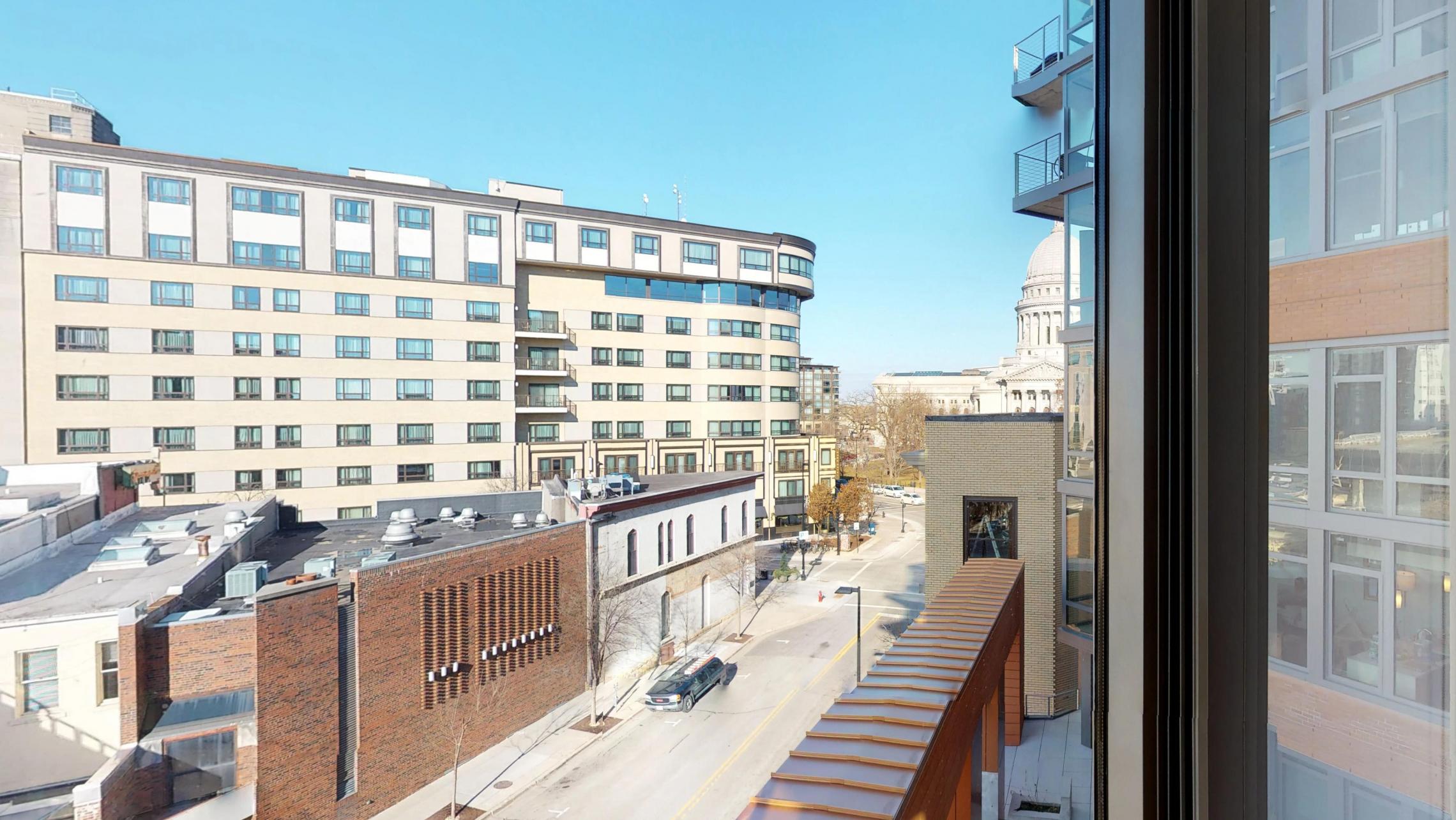 The-Pressman-Apartment-512-Two-Bedroom-Living-Room-View-Kitchen-Island-Downtown-Madison-Capitol-Balcony-Views.jpg