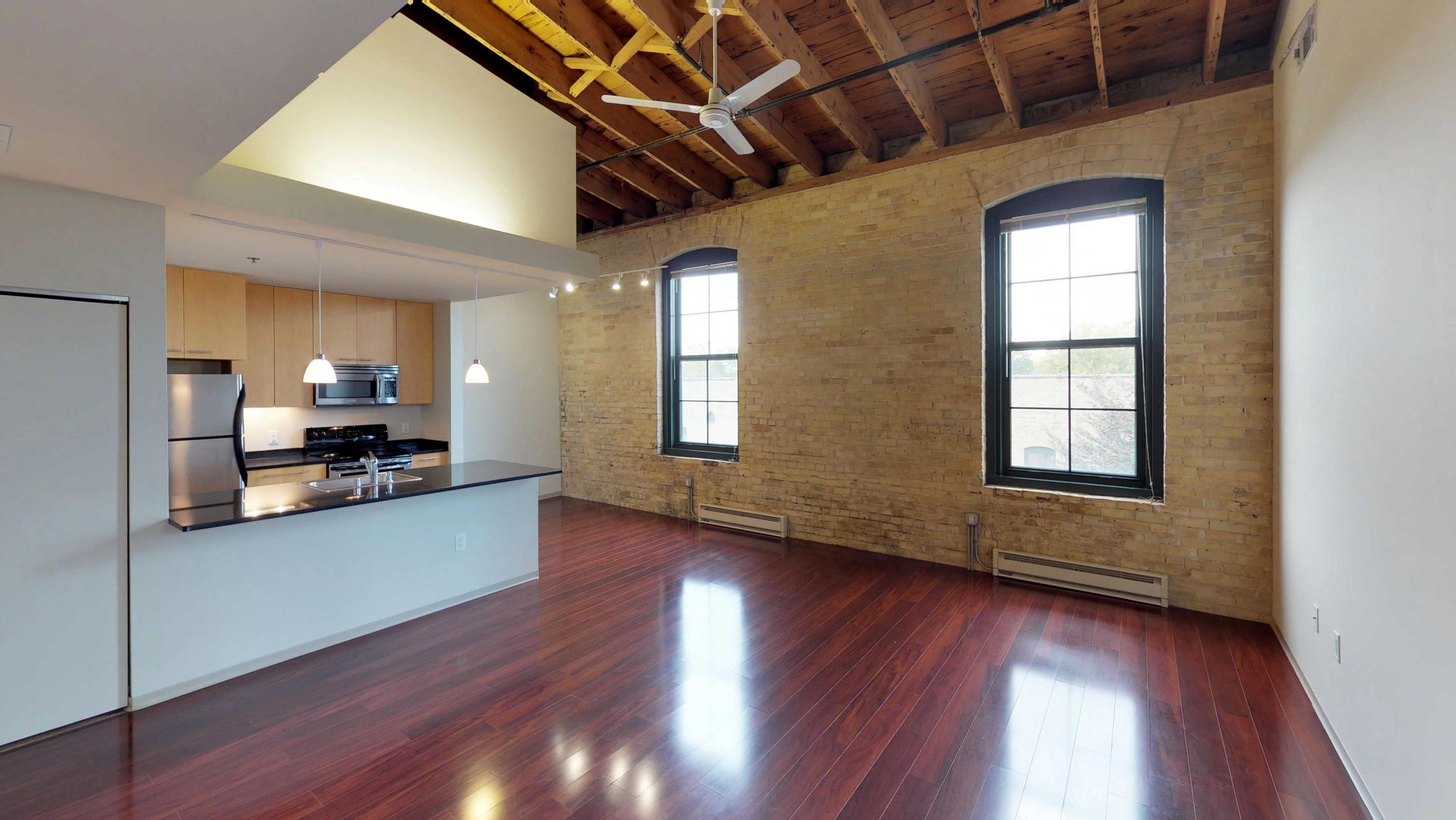 Tobacco-Lofts-Apartment-E312-Historic-Downtown-Two-Bedroom-Madison-Exposures-Brick-Vaulted-Ceiling-Yards.jpg