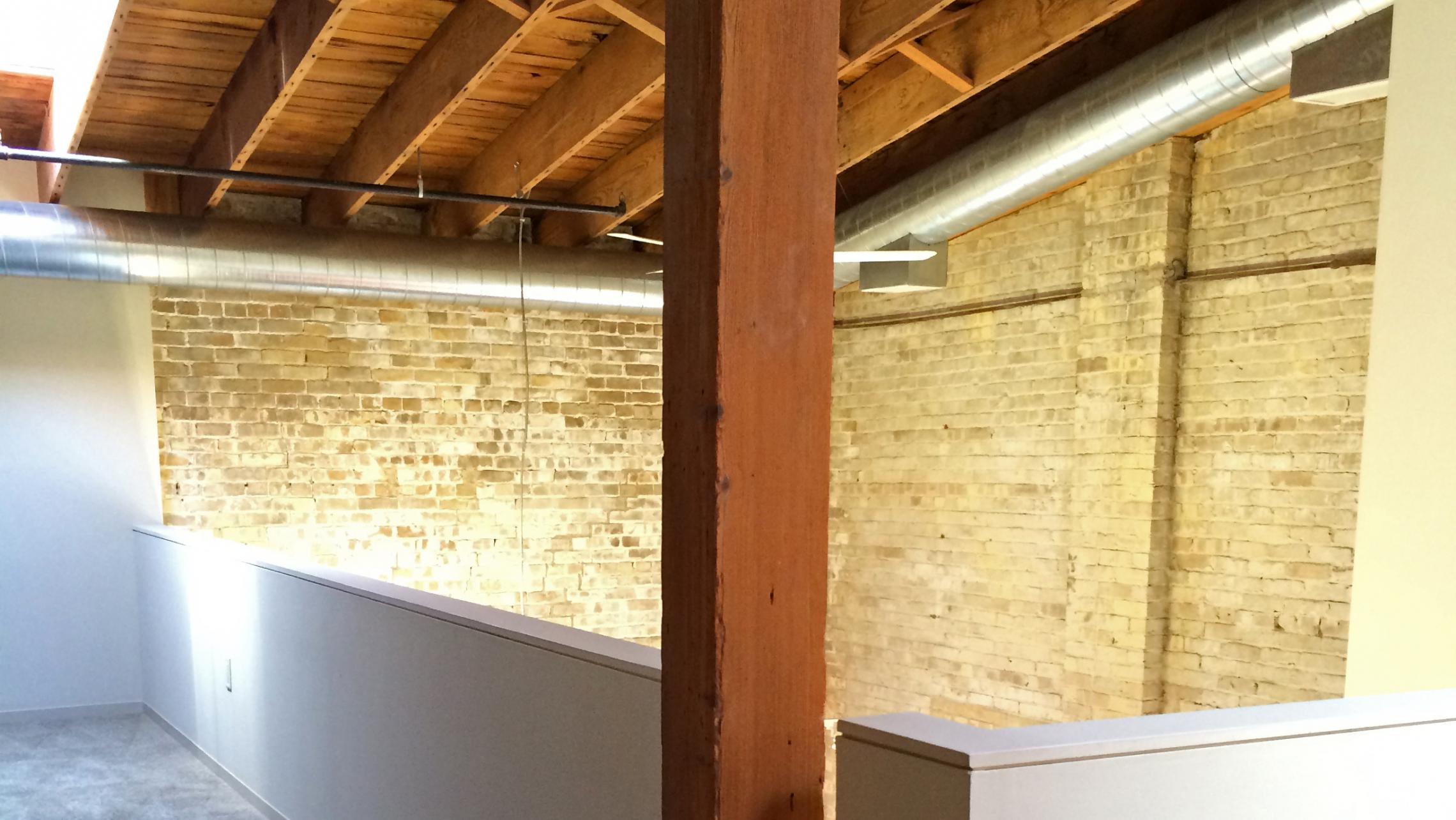 ULI Tobacco Lofts - E301 - Loft with Exposed Brick