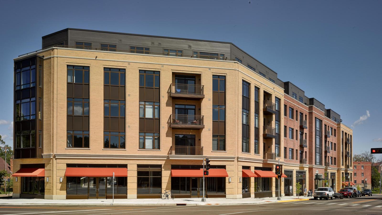 Modern exterior design with first floor retail and apartments above at 1700 Monroe 