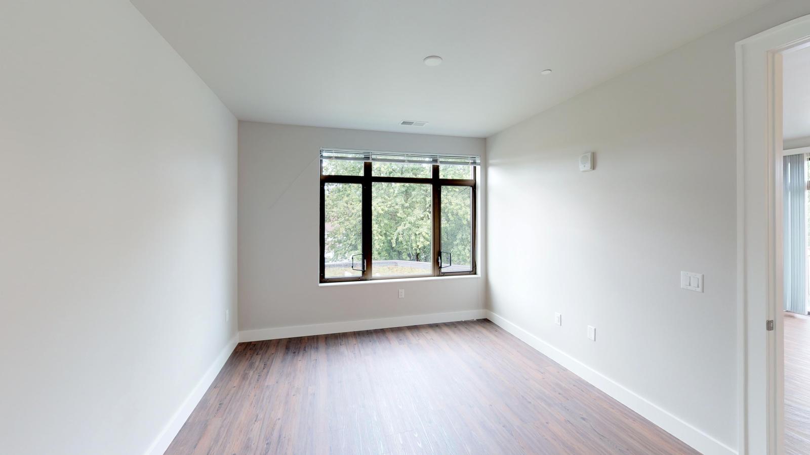 Bright and modern one-bedroom apartment at 1722 Monroe Apartments in Madison with natural light and classic finishes.
