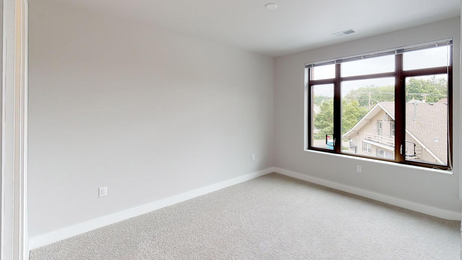 Bright two-bedroom apartment at 1722 Monroe Apartments in Madison with large windows and natural light.