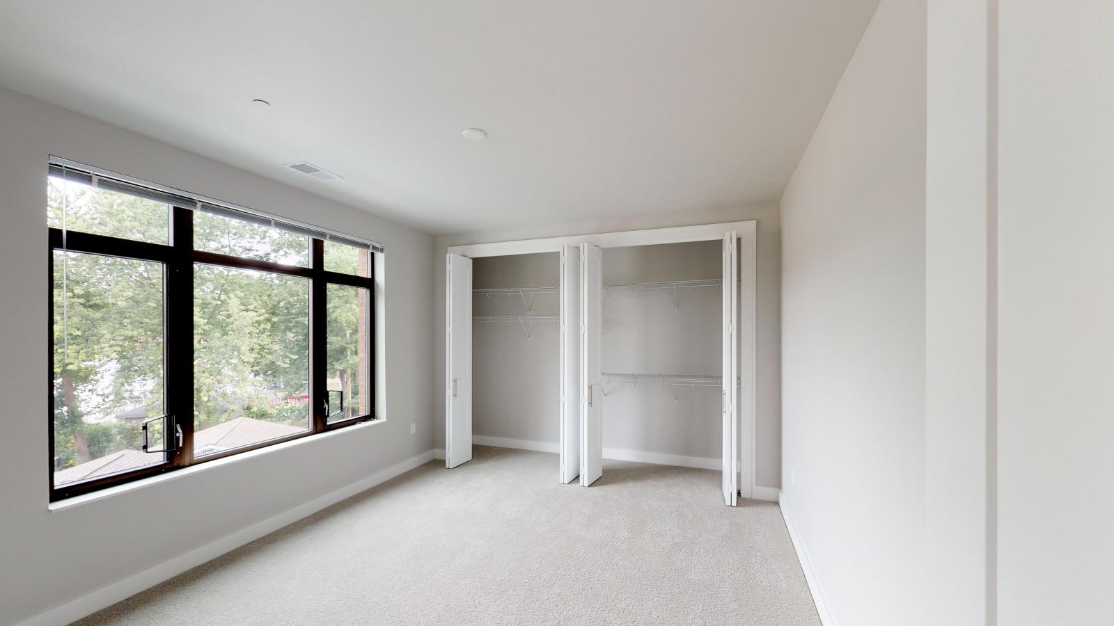 Bright two-bedroom apartment at 1722 Monroe Apartments in Madison with large windows and natural light and ample closet space.