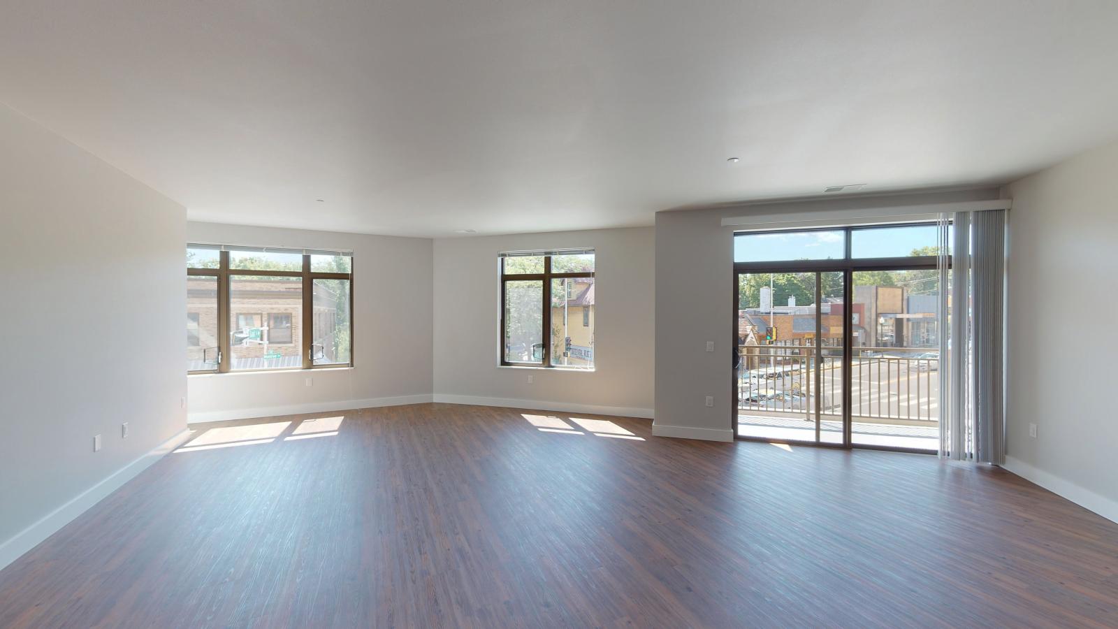 Spacious two-bedroom plus den apartment at 1722 Monroe Apartments in Madison with an open-concept layout and abundant natural light.