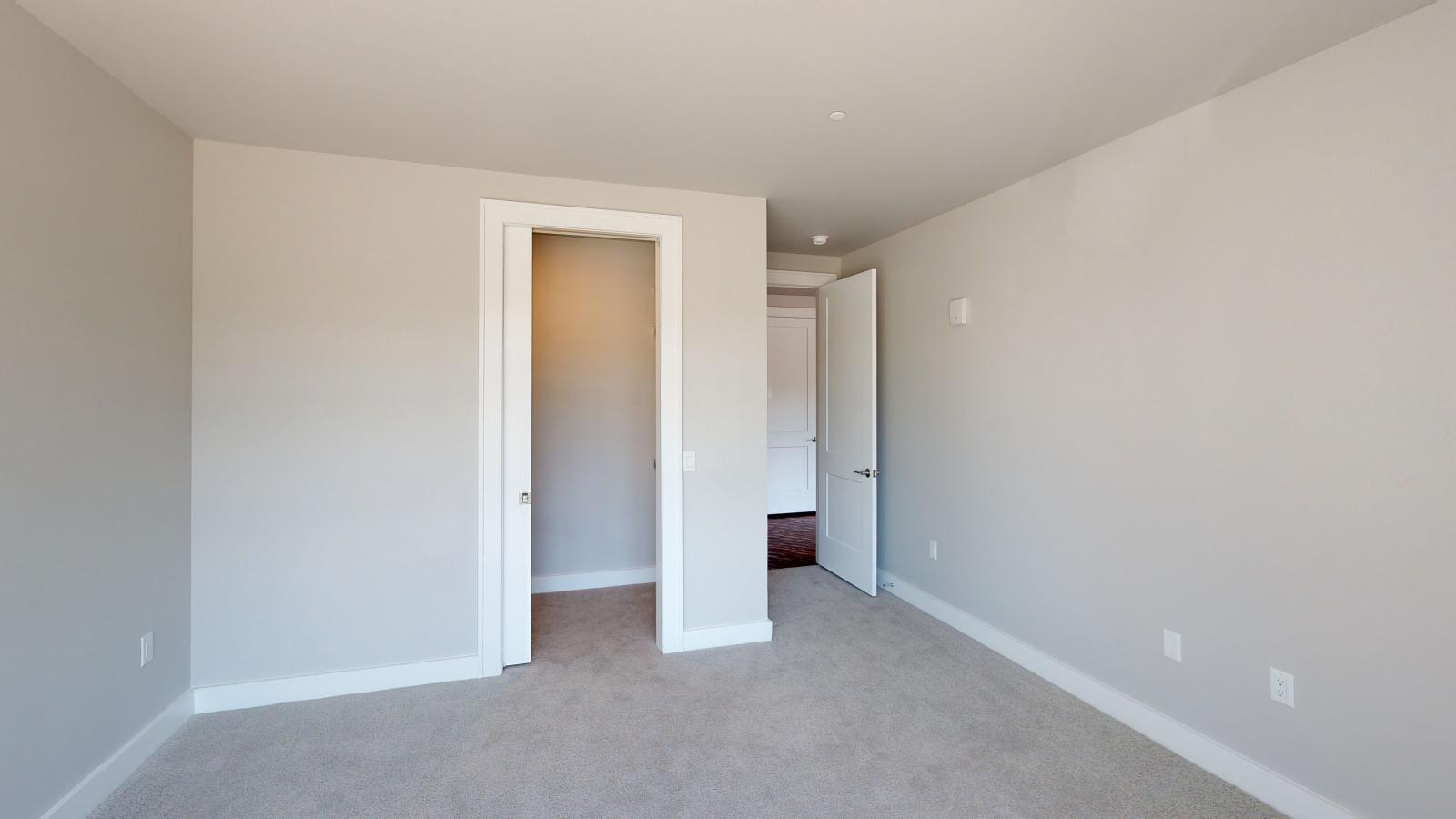 Spacious two-bedroom plus den apartment at 1722 Monroe Apartments in Madison with walk in closet and abundant natural light.