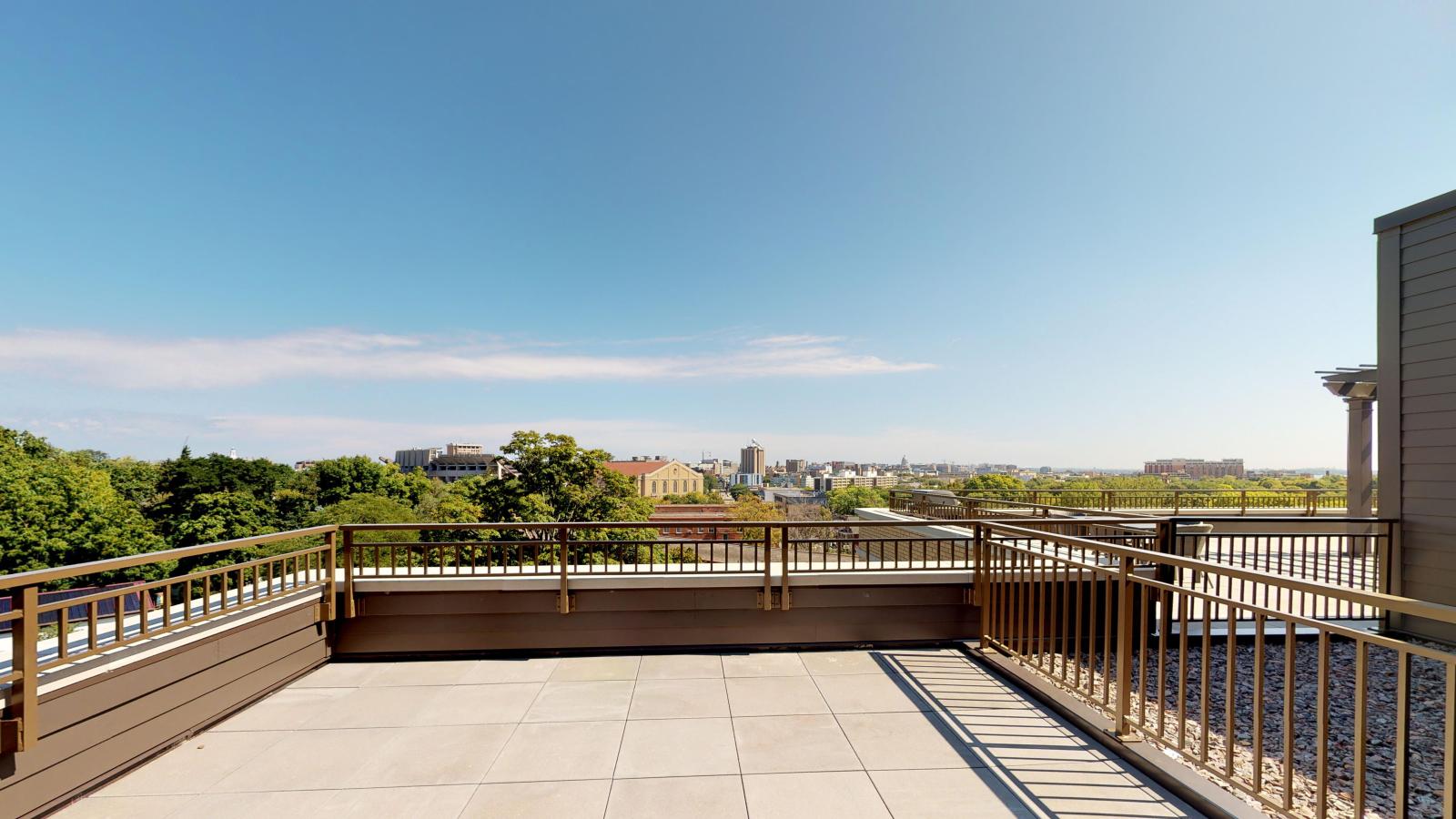 Elegant two-bedroom apartment at 1722 Monroe Apartments in Madison featuring a rooftop deck and Capitol views.