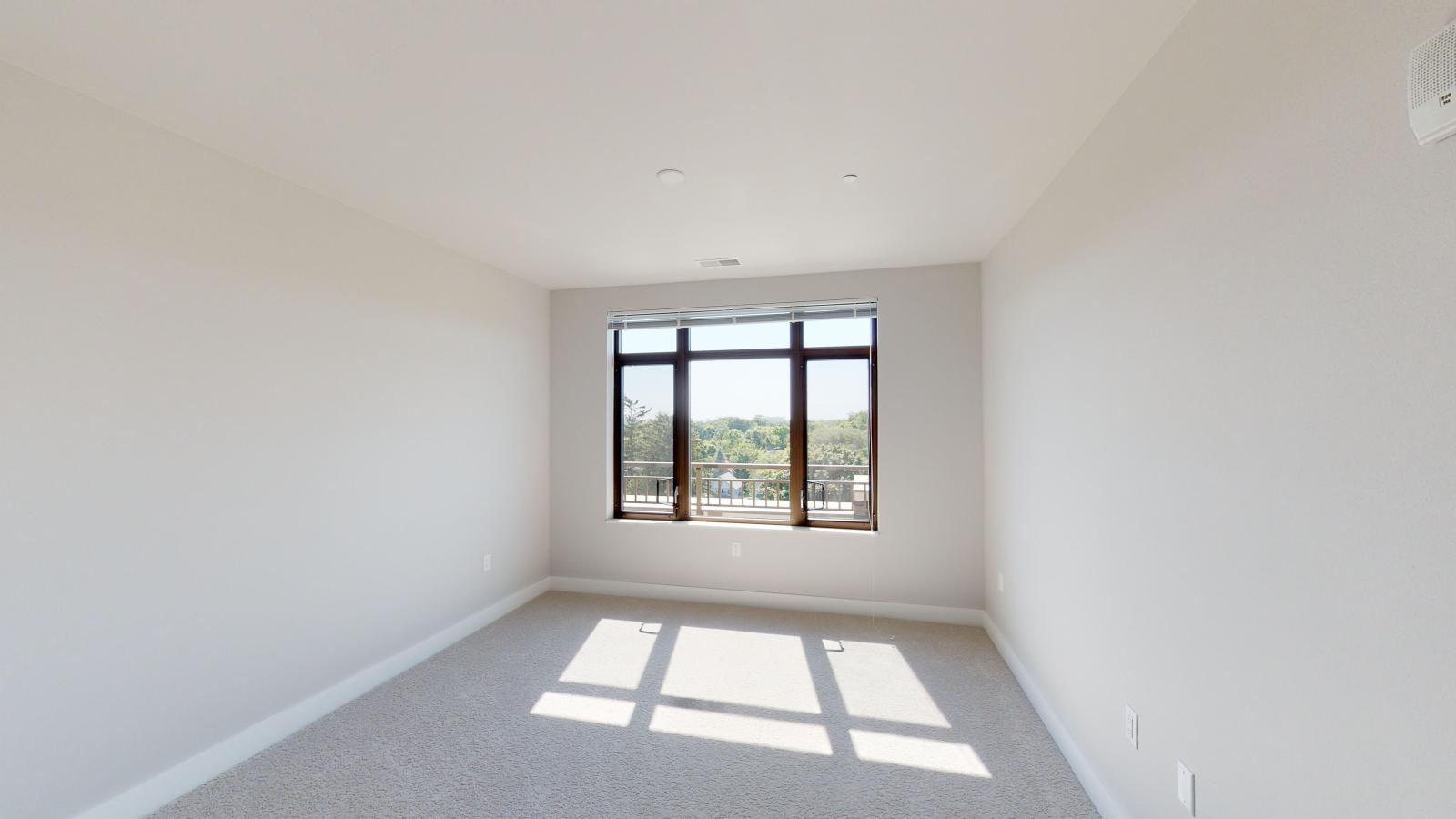 Bright two-bedroom apartment at 1722 Monroe Apartments in Madison with large windows and natural light.