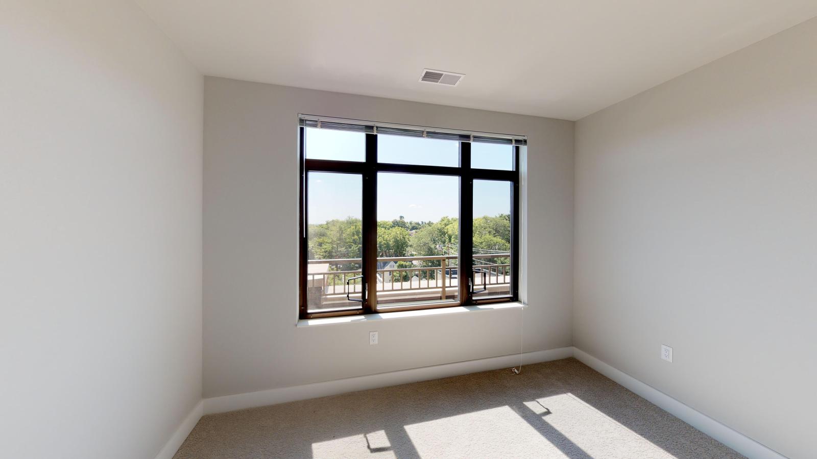 Bright two-bedroom apartment at 1722 Monroe Apartments in Madison with large windows and natural light.