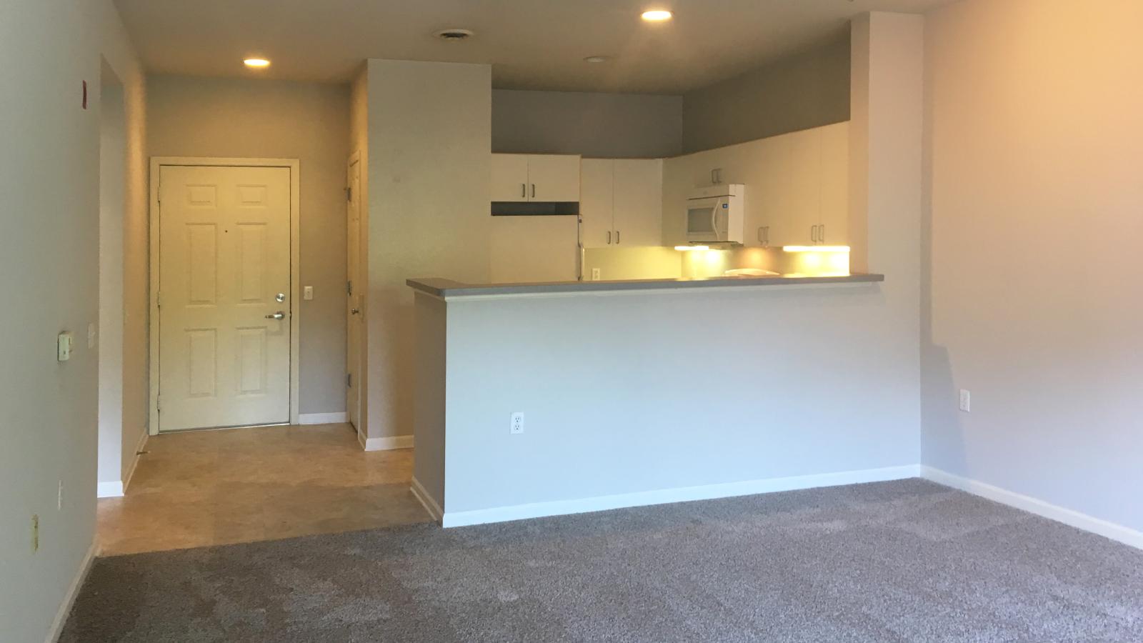 Kitchen with classic cabinetry and ample counter space in a one-bedroom at Wilson Bay