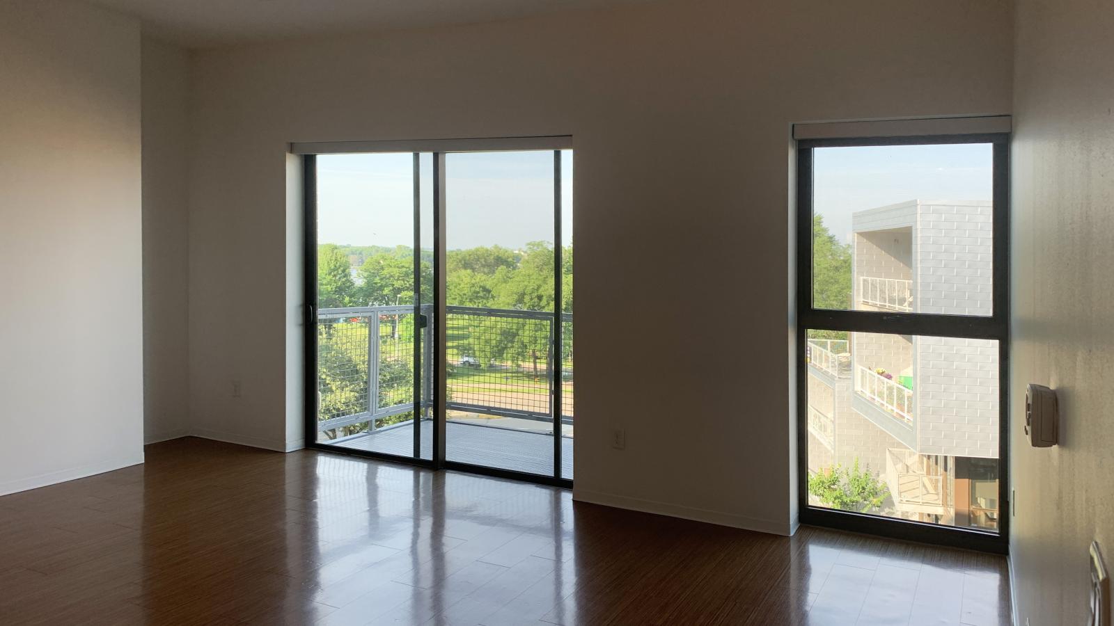 One bedroom apartment with balcony overlooking the landscaped courtyard at SEVEN27 in downtown Madison