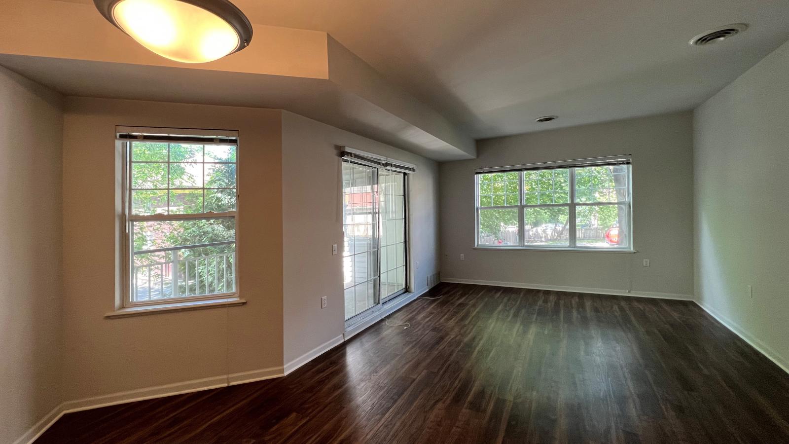 Cozy living room with soft finishes and a private balcony at Wilson Bay