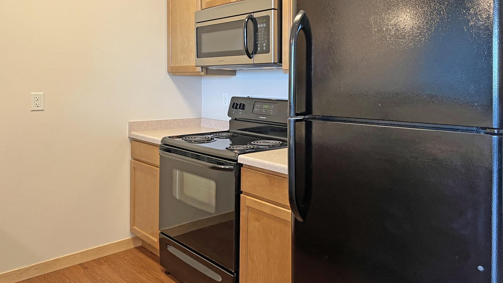 One bedroom apartment featuring a classic kitchen with ample counter space at The Depot in downtown Madison