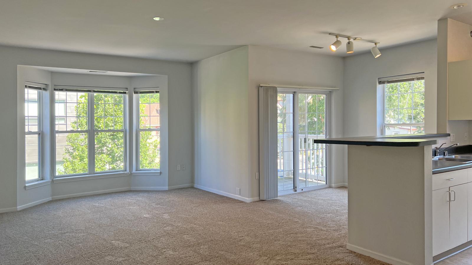 Large two-bedroom apartment with traditional finishes and bright bay windows at City Place