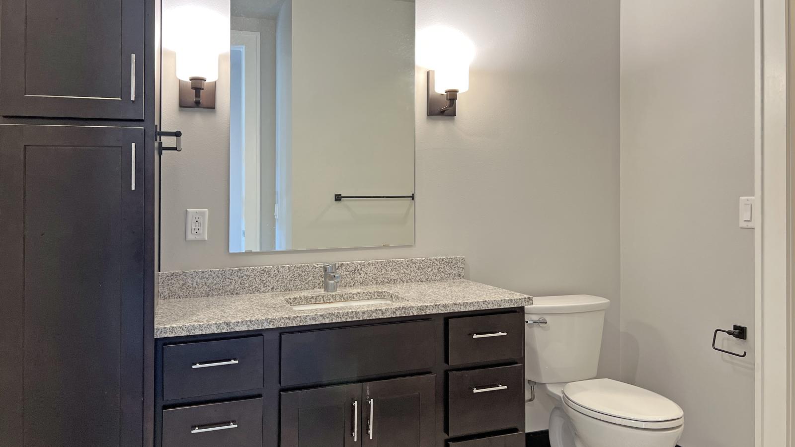 Modern one bedroom bathroom at 1722 Monroe Apartments in Madison with classic tile and laundry