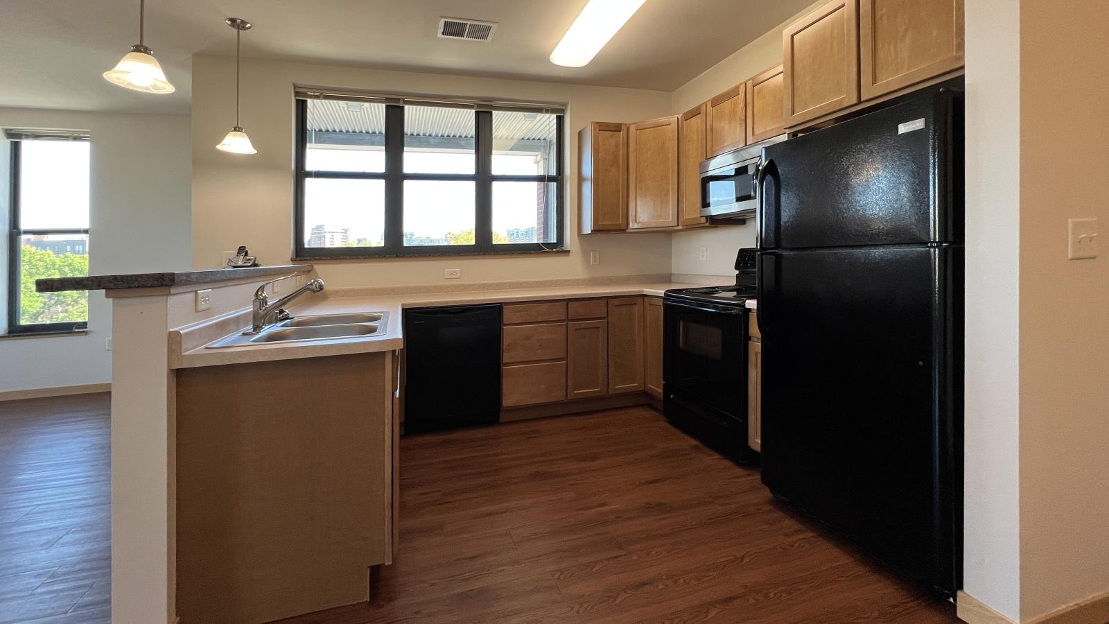 One bedroom apartment featuring a classic kitchen with ample counter space at The Depot in downtown Madison