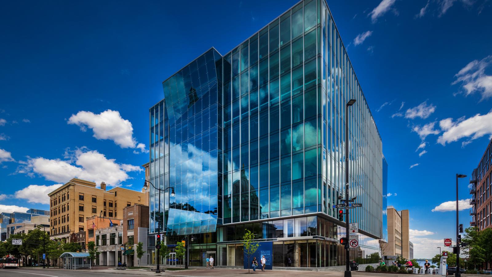 25 West Main exterior featuring a modern glass façade and Class A office space in downtown Madison