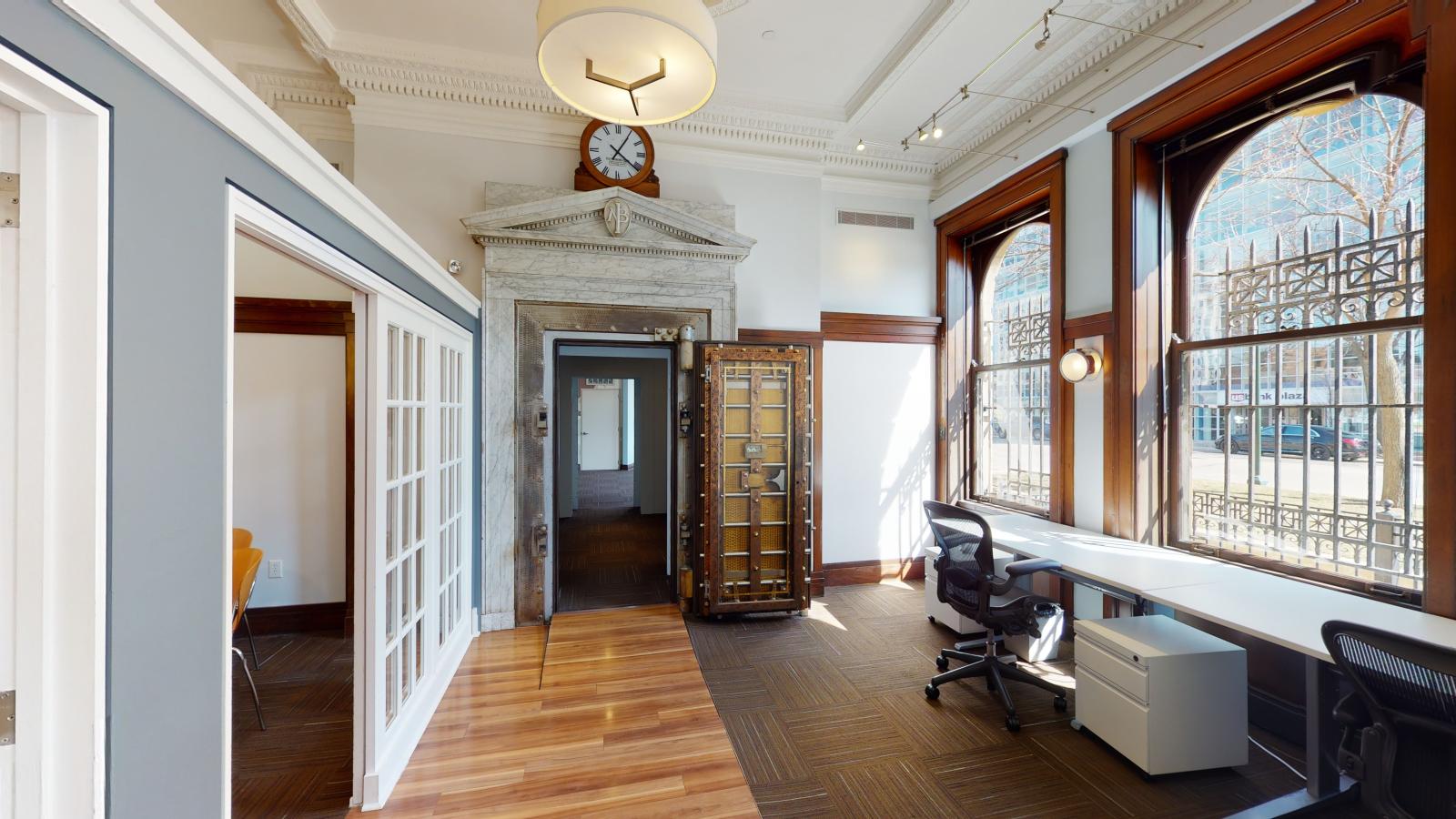 Dream Bank interior with abundant natural light streaming through large windows at American Exchange 