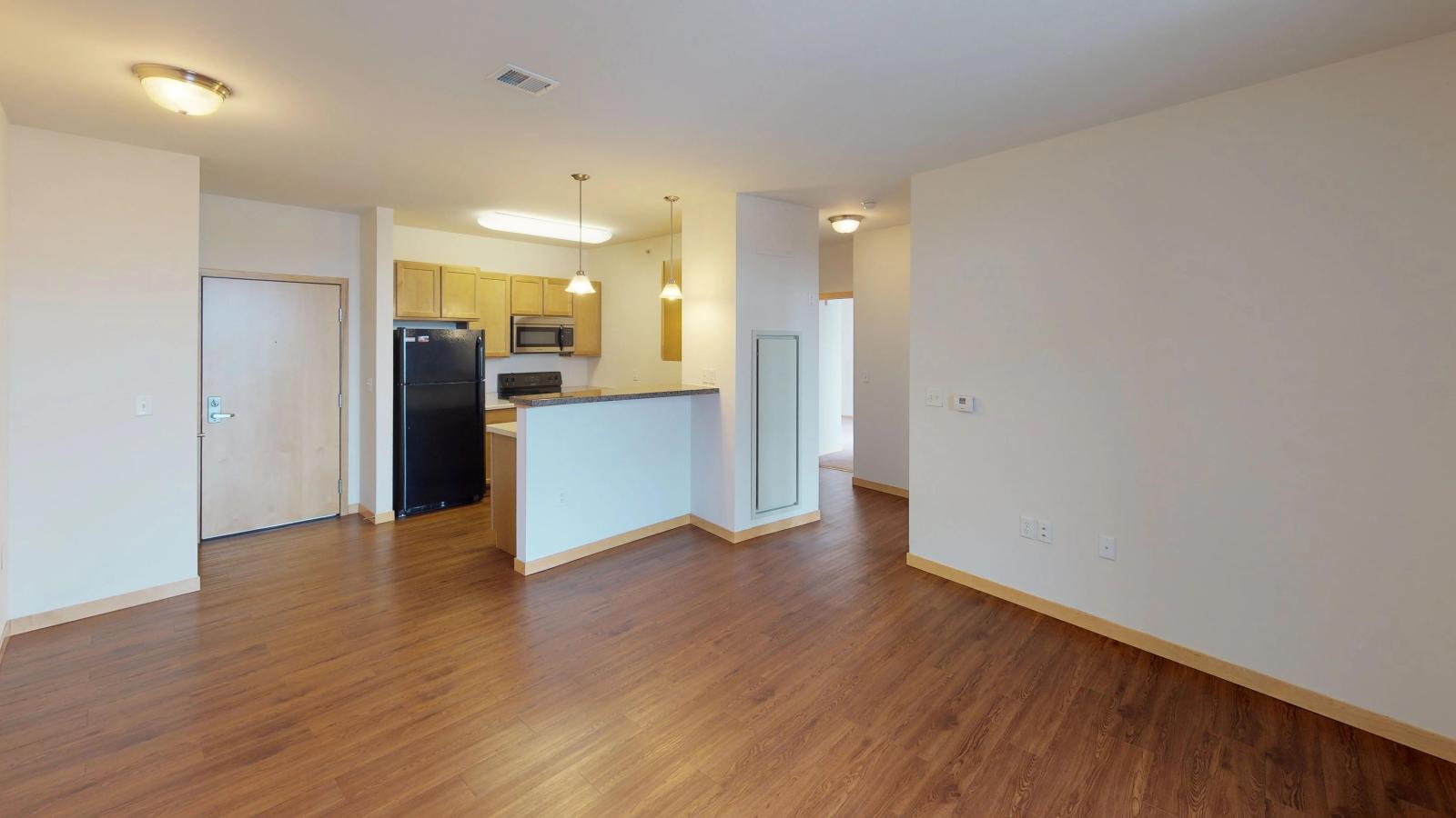 One bedroom plus den apartment with a spacious layout and private balcony and stunning sunlight at The Depot in downtown Madison