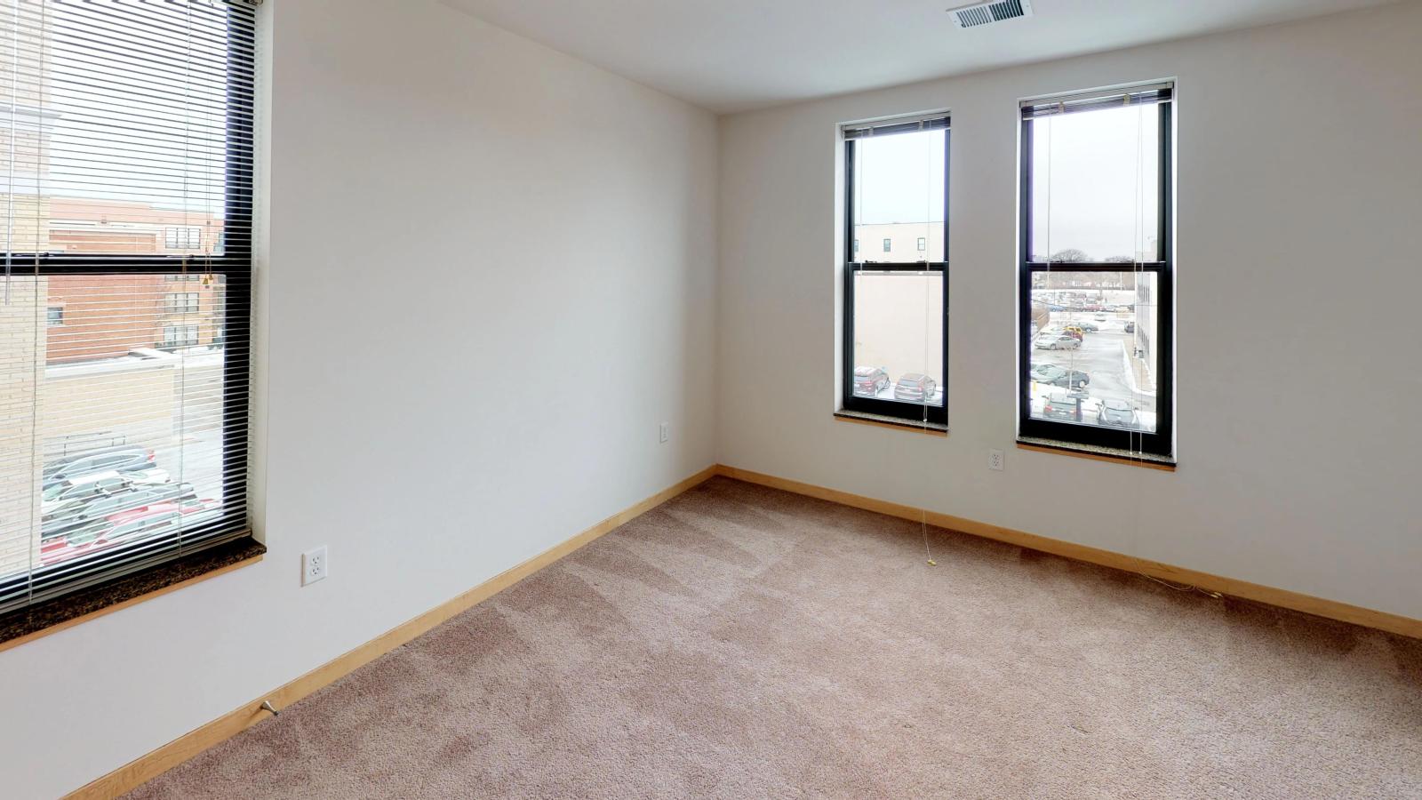 Spacious one bedroom plus den apartment with a walk in closet and natural light in main bedroom at The Depot in downtown Madison