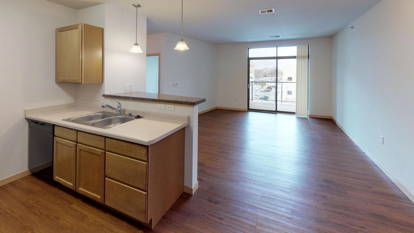 One bedroom plus den apartment with a spacious layout and private balcony and stunning sunlight at The Depot in downtown Madison