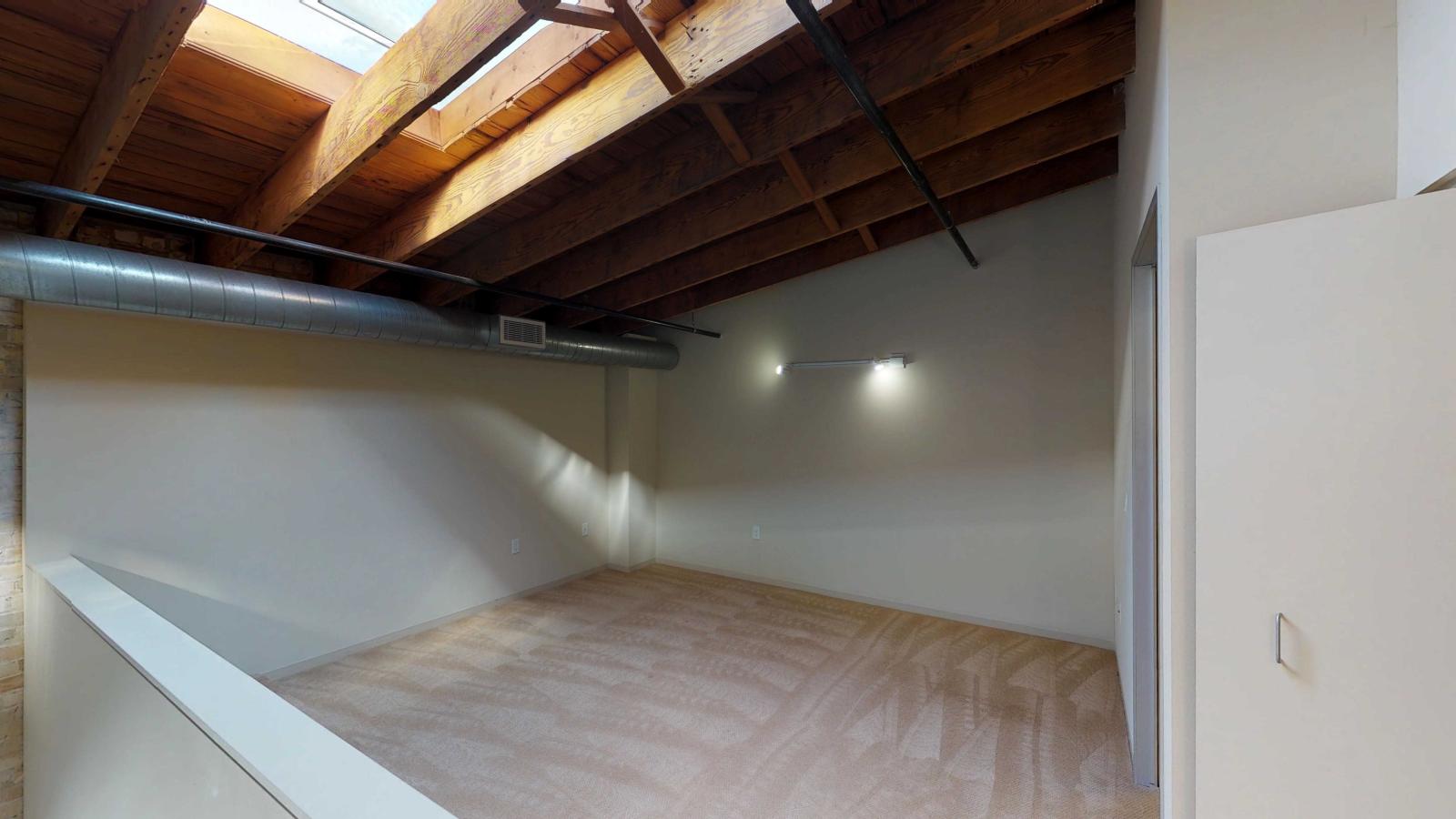 Loft style two bedroom featuring a skyight with industrial modern finishes at Tobacco Lofts