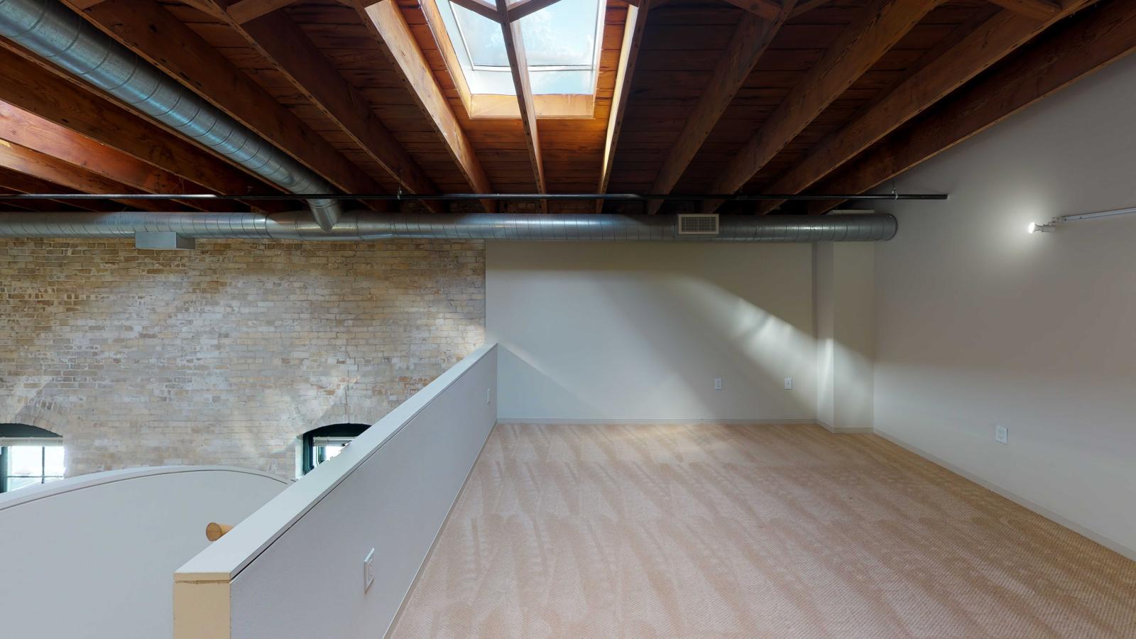 Loft style two bedroom featuring a skyight with industrial modern finishes at Tobacco Lofts