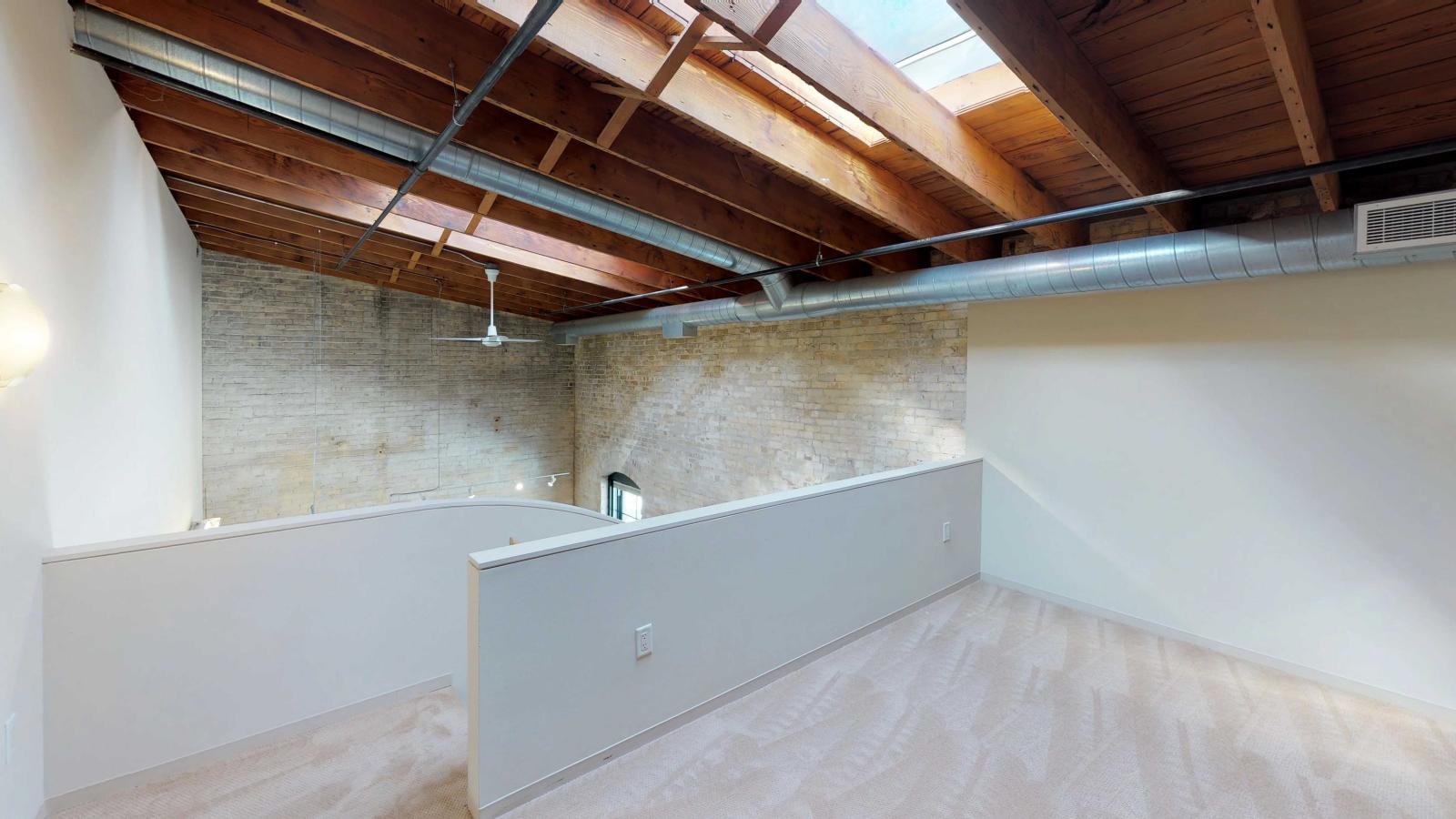 Loft style two bedroom featuring a skyight with industrial modern finishes at Tobacco Lofts