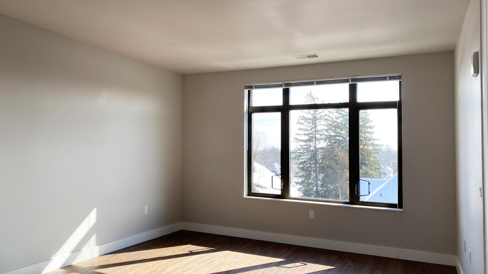Bright and modern one-bedroom apartment at 1722 Monroe Apartments in Madison with natural light and classic finishes.