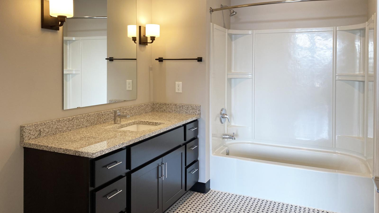 Elegant apartment at 1722 Monroe Apartments in Madison with classic tile bathrooms and soft finishes.