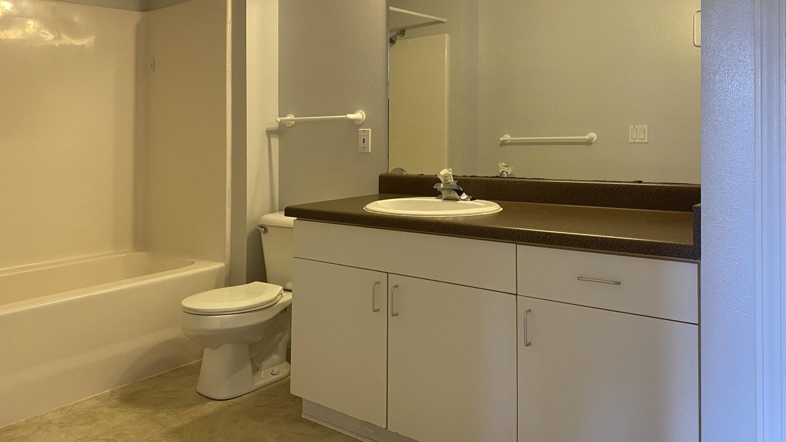 Classic bathroom with traditional fixtures at City Place Apartments