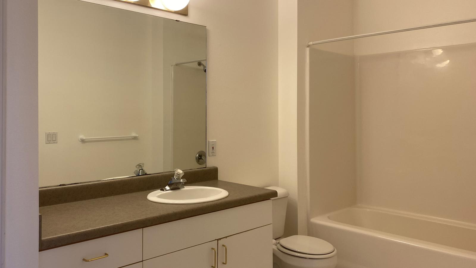 Classic bathroom with traditional fixtures at City Place Apartments