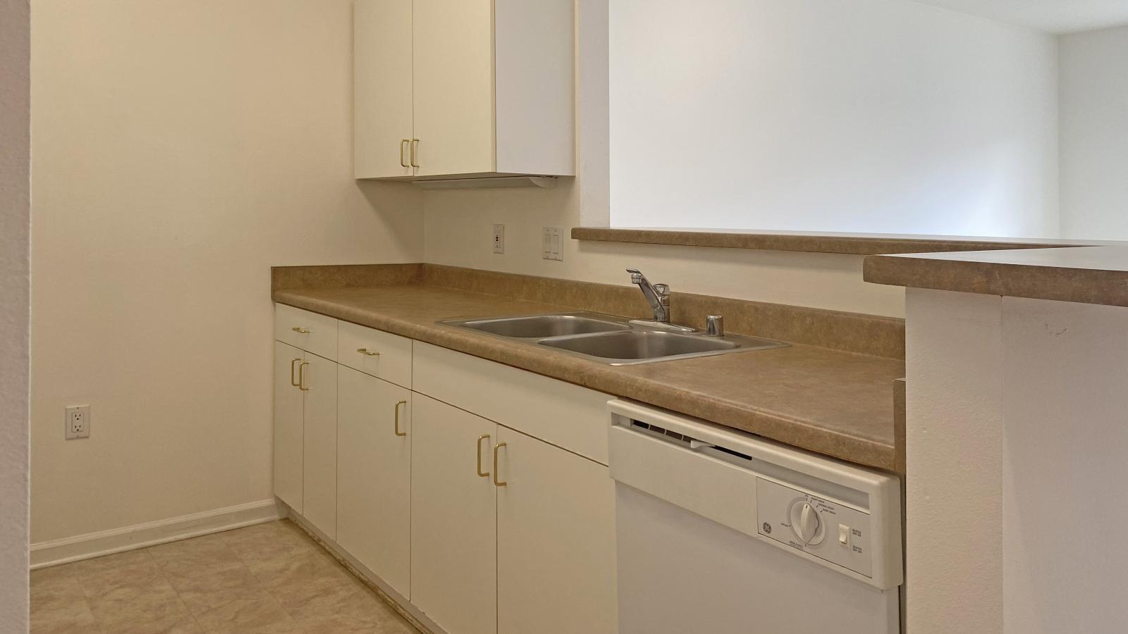 Kitchen with standard appliances and cabinetry at City Place Apartments