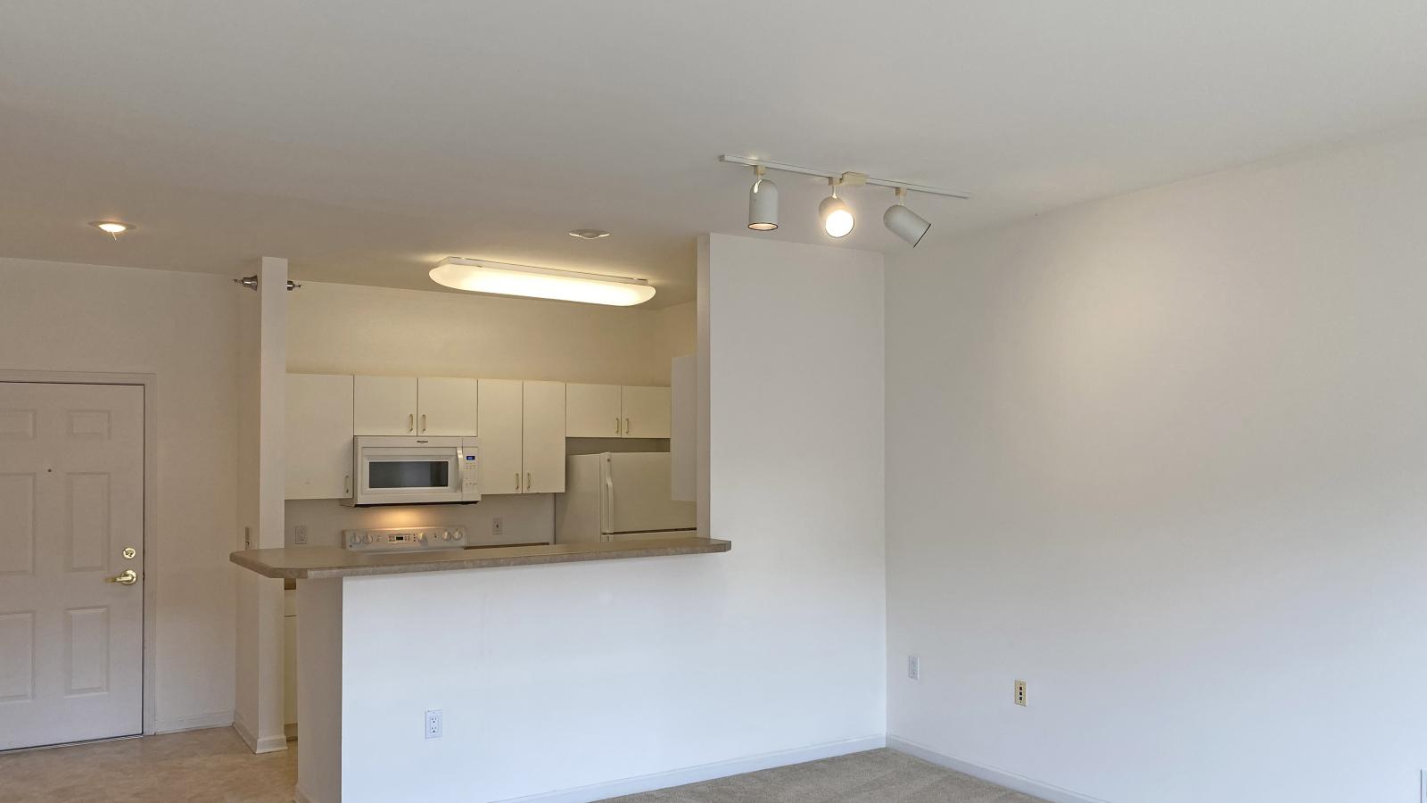 Living room with soft finishes and private balcony at City Place