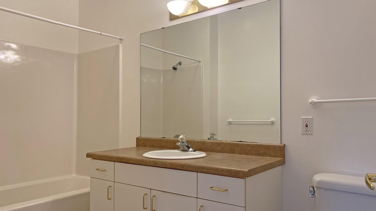 Classic bathroom with traditional fixtures at City Place Apartments