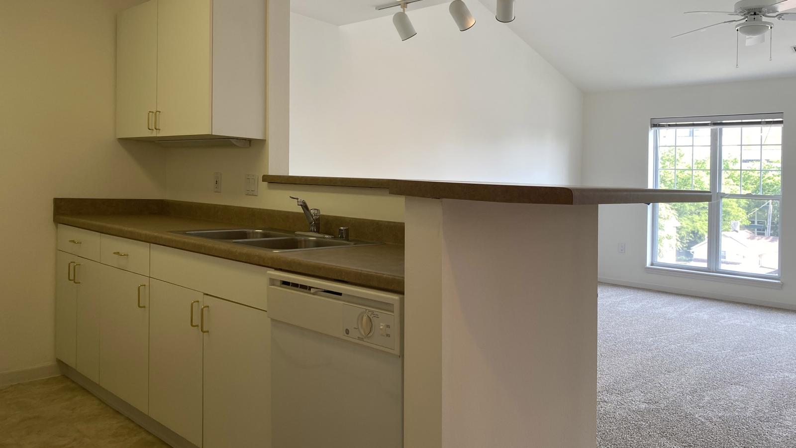 Kitchen with standard appliances and cabinetry at City Place Apartments
