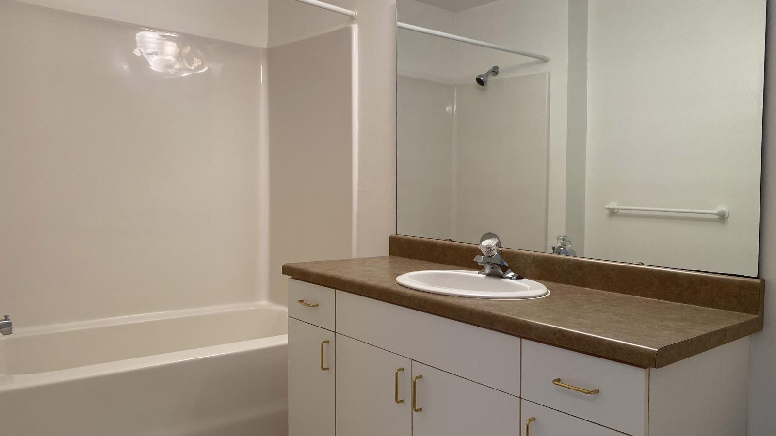 Classic bathroom with traditional fixtures at City Place Apartments