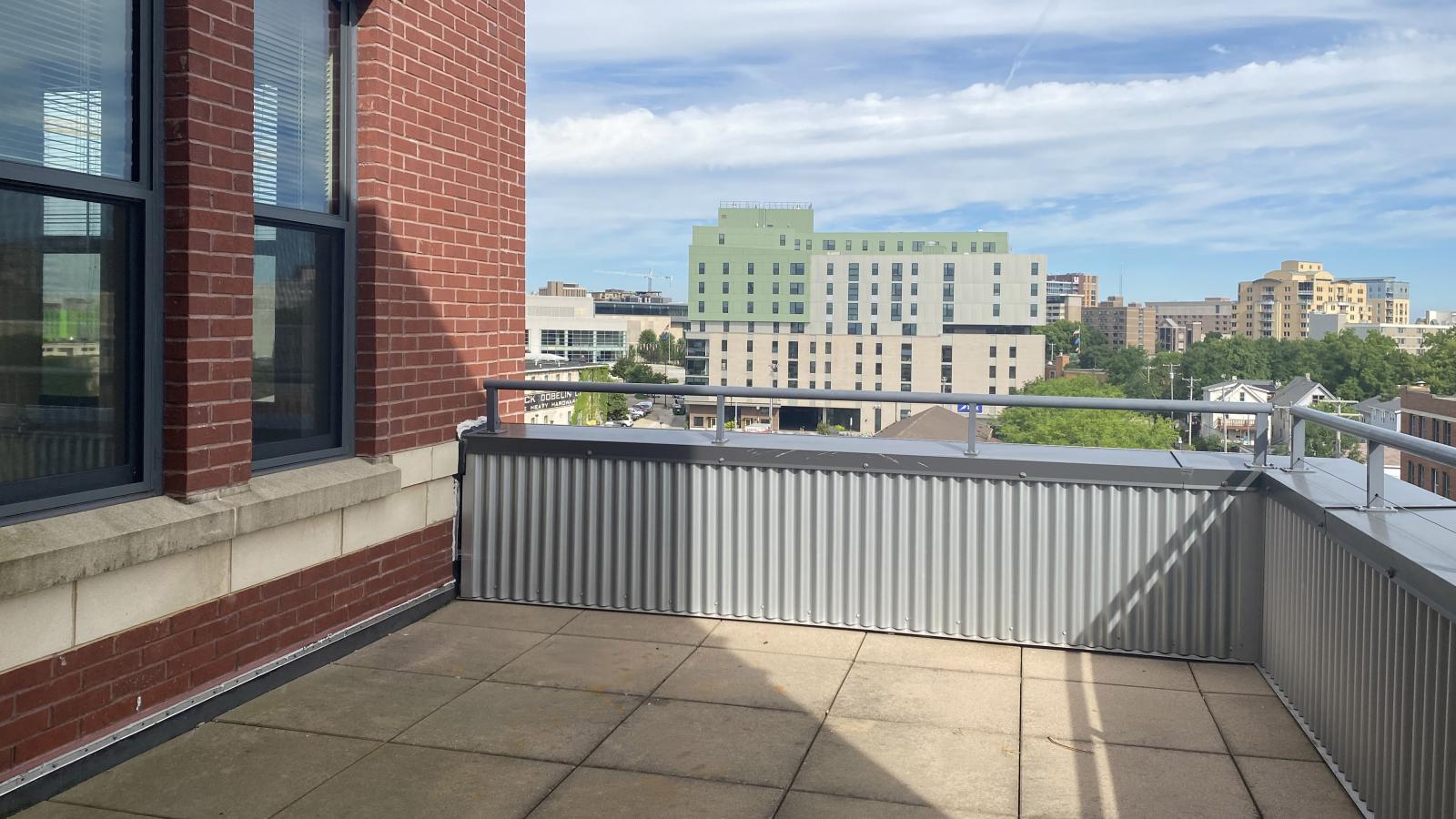 Two bedroom den apartment with an open floor plan and private balcony at The Depot in downtown Madison