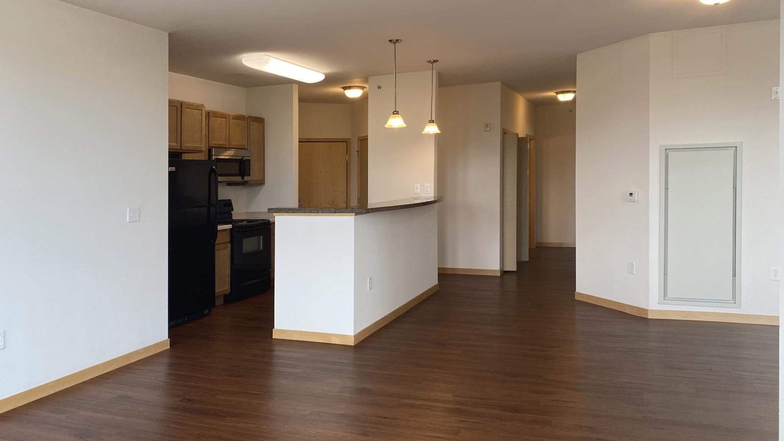 Two bedroom den apartment with standard kitchen appliances and generous living space at The Depot in downtown Madison